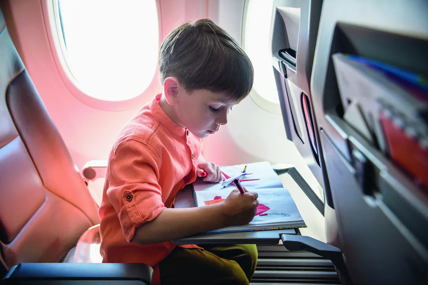 Keeping your children entertained during long trips can help avoid crying and disruptive behaviour.