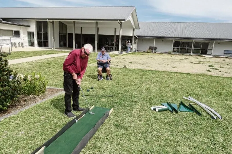 Anyone for mini-golf? Locals at Horizon Village showing their skills on the new course recently built by Col Henderson. Photos: Alan Nelson.