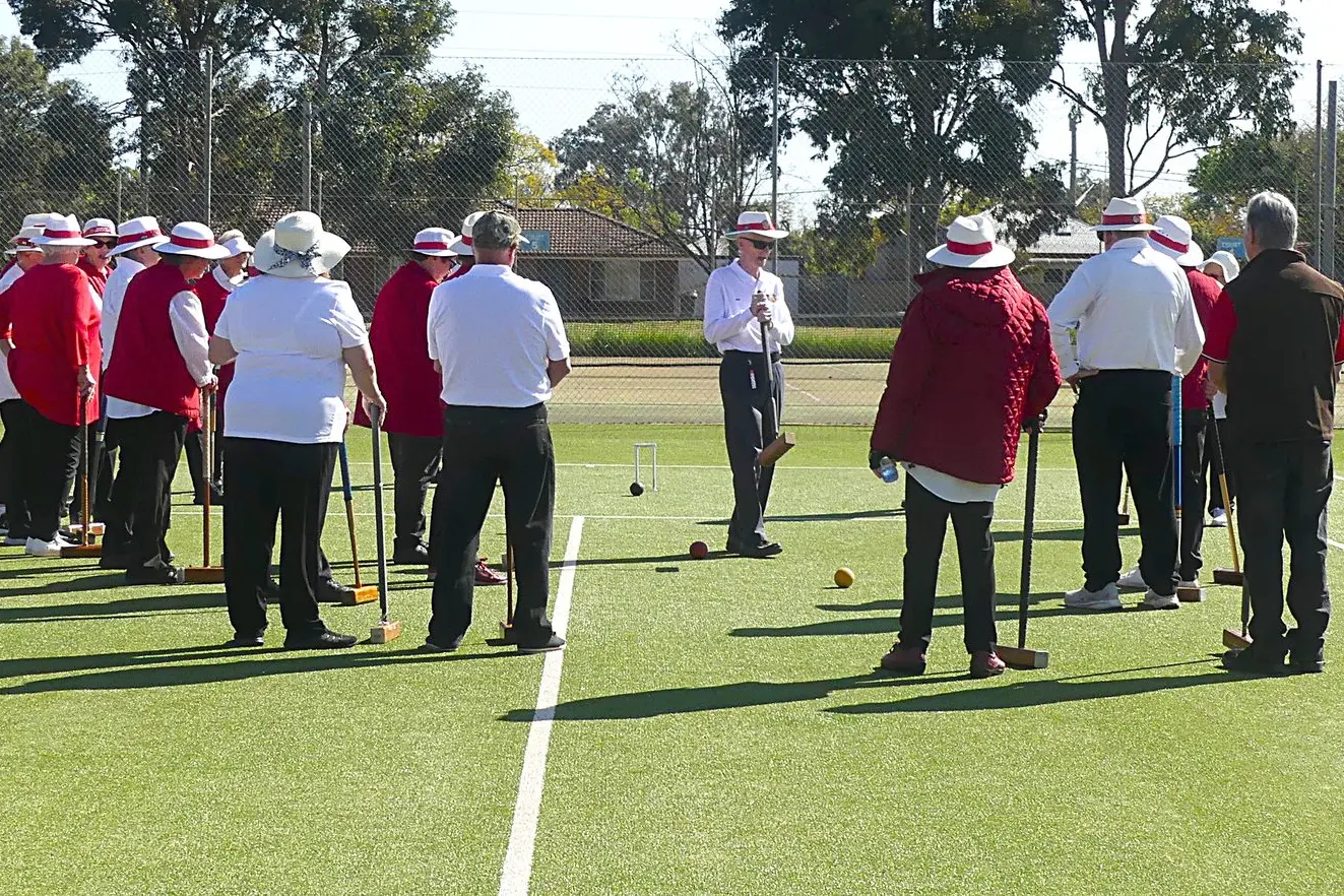 Club captain Ben Vang instructing players on how to play Aussie Croquet at Dubbo Croquet\\u2019s 103rd Birthday. Photos: Supplied