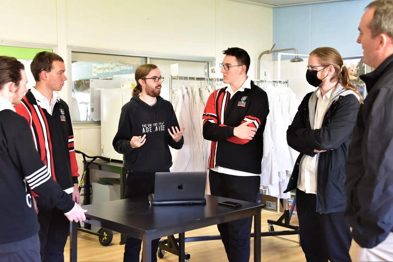 MIT PhD student and Dubbo College alumnus Elijah Stanger-Jones (centre) returned to Dubbo earlier this month to see family and speak with Dubbo College students. Photo: Dubbo College