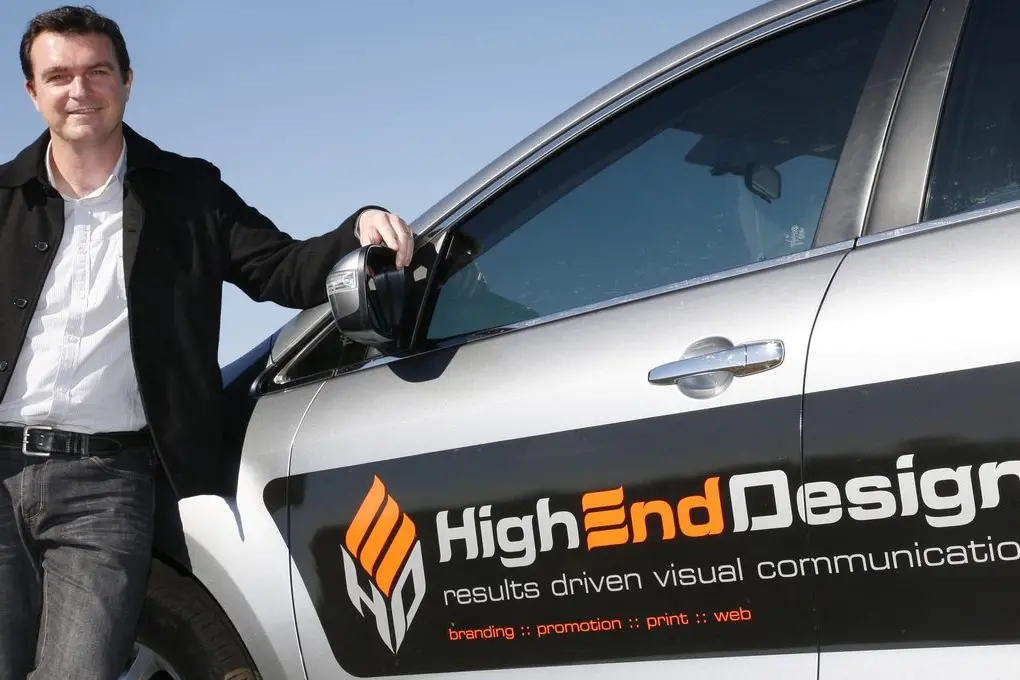 High End Design owner and graphic designer Justin Farrell says many things have changed over his three decades in the graphic arts industry, but he still gets a kick out of seeing his finished work on shelves. Photo: High End Design