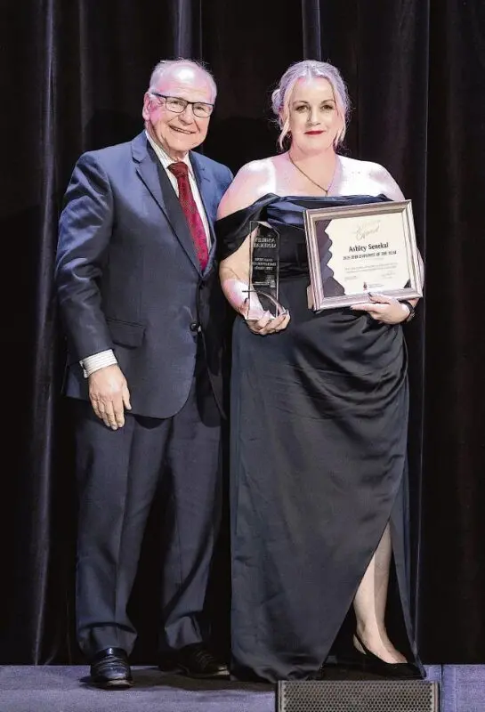 RFBI Chair David Adams presents local Dubbo quality officer, Ashley Senekal, with her 2025 Employee of the Year award. Photo: Supplied