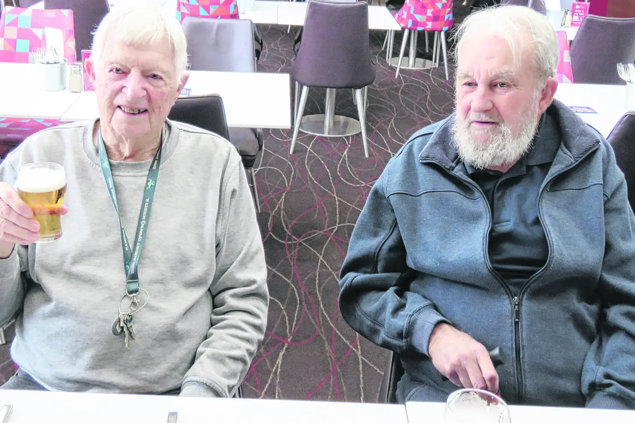 Cheers! Doug Elliott and John Morice during the Horizons Village Men\\u2019s Shed lunch. Photos: Supplied.