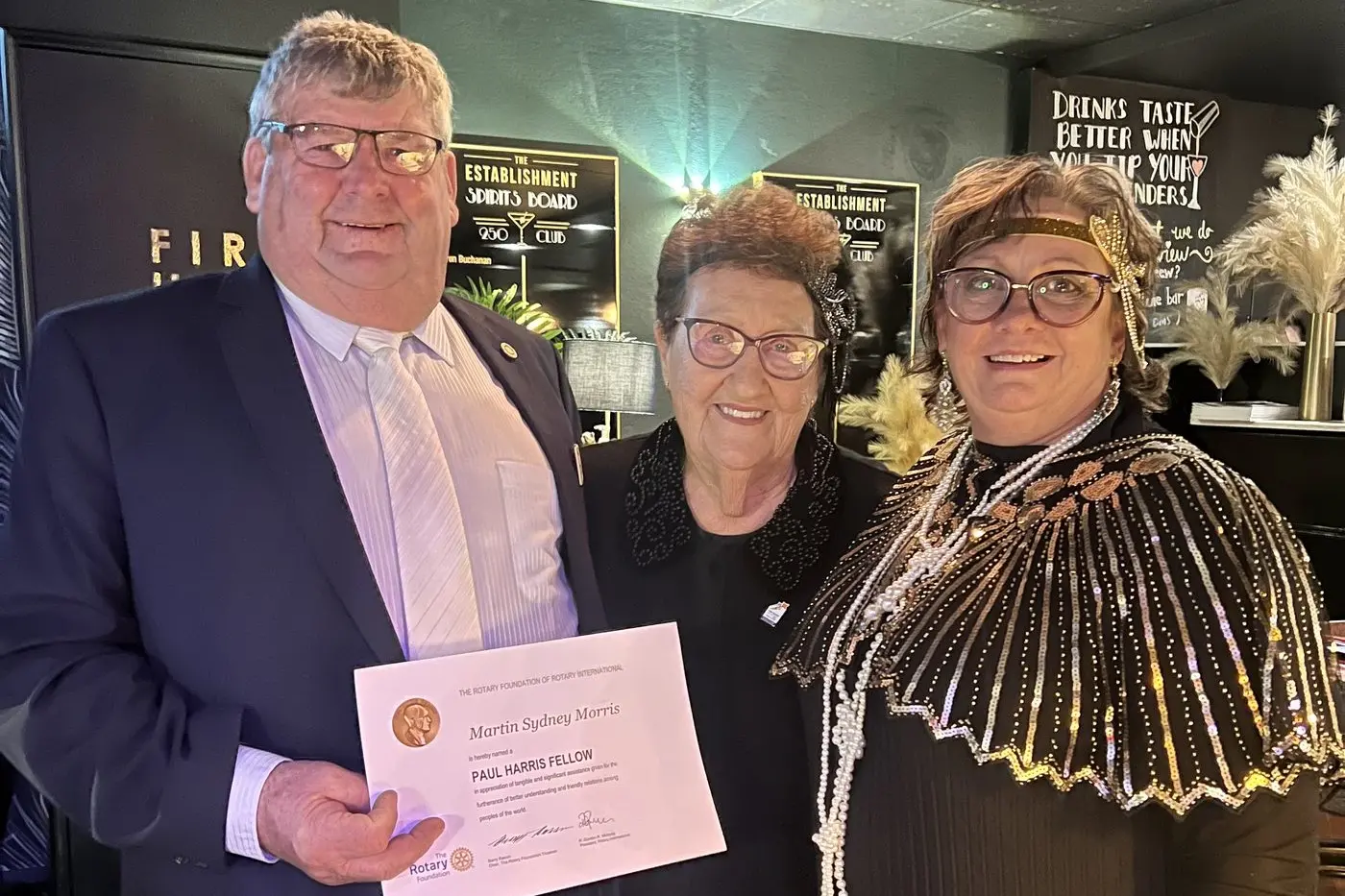 Rotary Club of Dubbo Macquarie president Lorraine Holland with Paul Harris Fellow Marty Morris and his partner and club charter member Lorna Breeze. Photo: Contributed by Rotary Club of Dubbo Macquarie