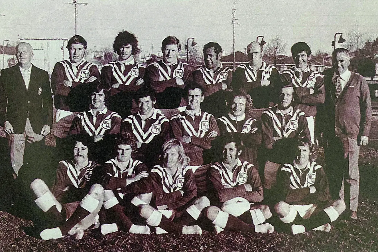 The only Western Division team photo from the 1974 season, taken during a training run. Back: Bill Baker (trainer), Ian Toohey, Terry Fahey, Greg Fearnley, Dennis Richie, Ted Ellery, Johnny King (coach), Col McDonnell (manager). Middle: Peter Walkom, Nelson Smith, Paul Dowling (captain), Billy Rose, Paul Sams. Front: Dave Ross, Norm Armstrong, Bob Pilon, Frank Fish, Rod McDonald. *Dav Kent would come into the team for Fahey; Peter Frew would replace Fish. Photo: Contributed