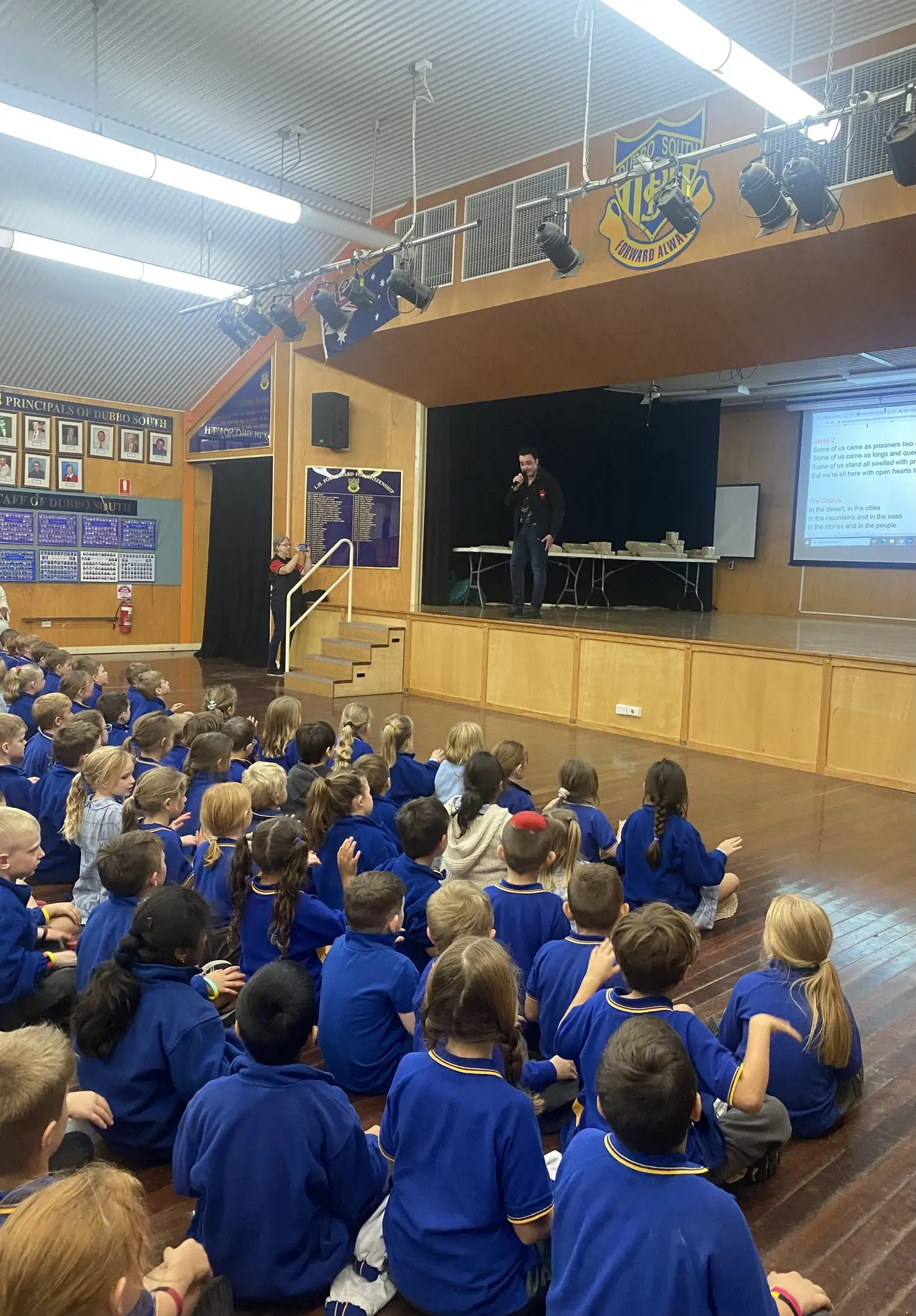 Singer and co-founder of Doin it For Rural Aussie Kids, Jason Owen, performing his latest single \\u2018Sing Australia\\u2019 at Dubbo South Public School. Photo: Dubbo Photo News.