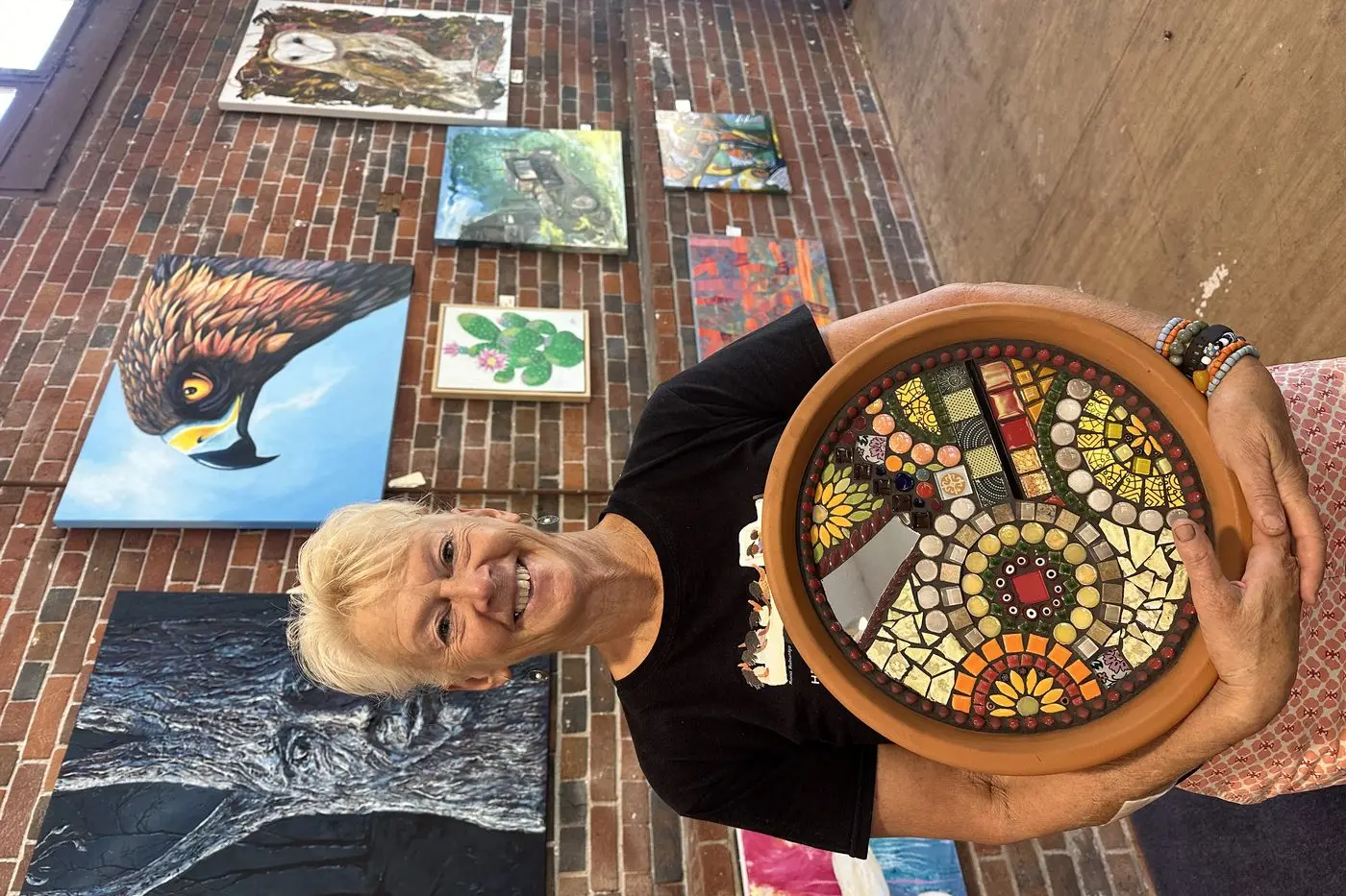 Arts Curator with Wellington Arts, Lisa Thomas, with mosaic art. Photo: Dubbo Photo News/Lana Eather.\\n