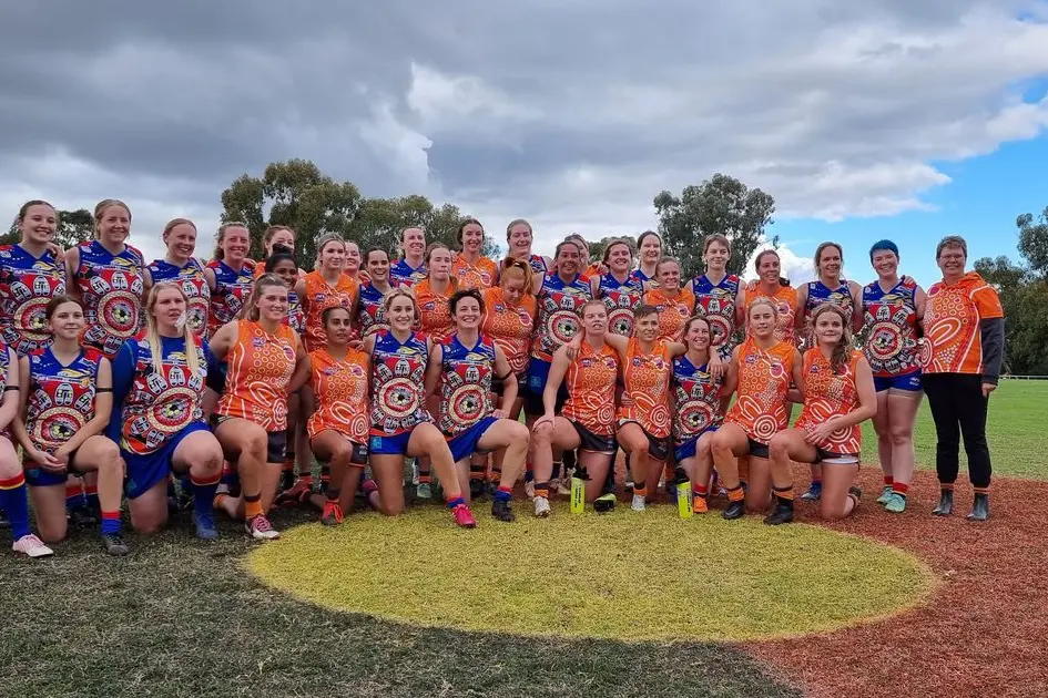 The Demons and the Giants joined together for a photo after an intense game. 