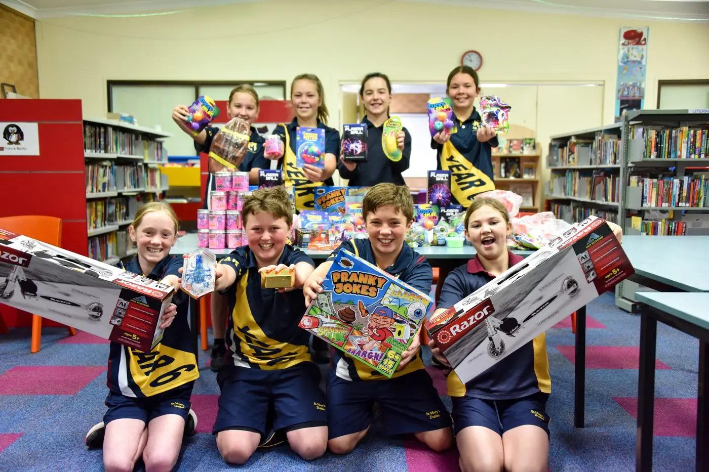 St Mary\\'s Catholic School students (back)  Audrey Cook, Georgia Pilon, Chloe Bell, Kobi Williams, \\n(front) Sophie Bonnington, Dusty Ward, Jed Salloum, Evie Slack-Smith collecting toys for Christmas donations for Vinnies and LeaderLife. Photo: Supplied 