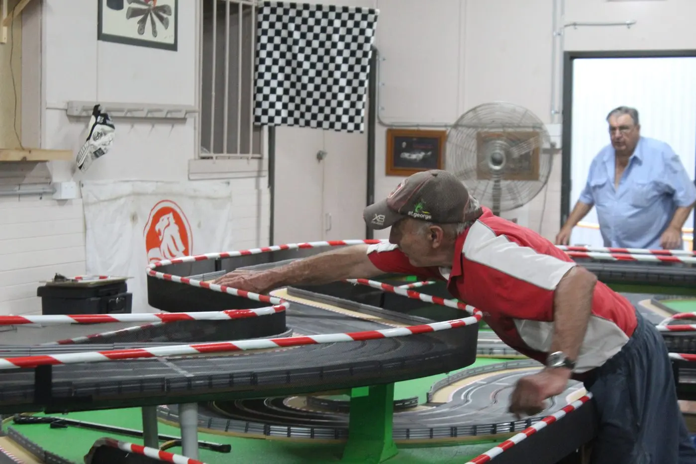 Robert Hoverton spotting any cars falling off their runners