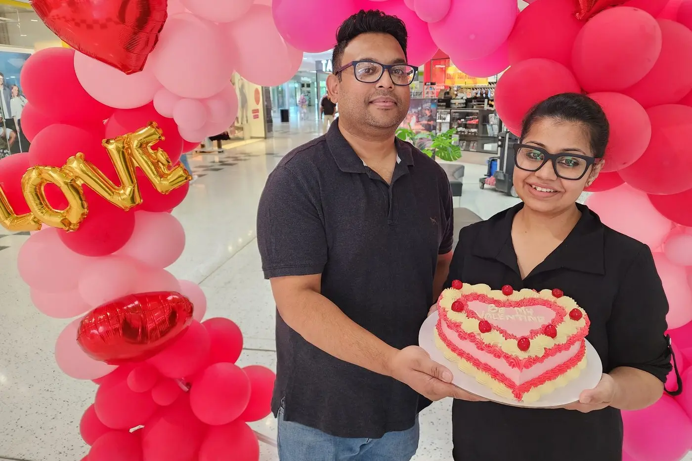 Faisal Eusufzai and Jannatul Tazrin of Creme Patissiere at Orana Mall Dubbo with one a highly attractive Valentine cake. Photo: Dubbo Photo News/Ken Smith