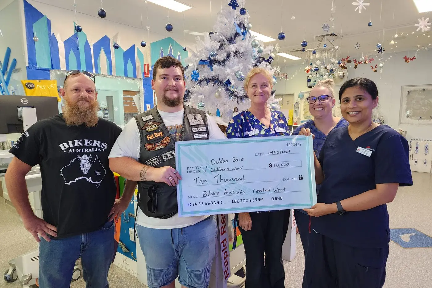Out picture shows Kai Adams, with Luke Smith from Biker\\u2019s Australia Central West Branch, presenting the cheque to Jules Gregory, Kasey Streat and Dafini Paul from Dubbo Base Hospital Children\\u2019s Ward. Photo: Dubbo Photo News. 