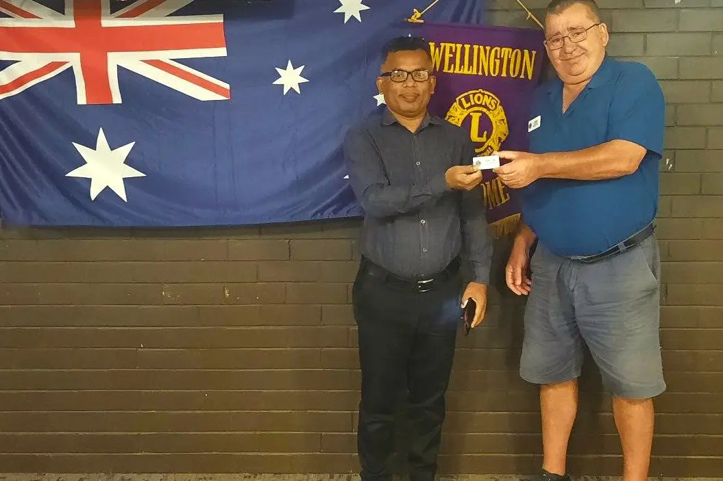 Welcome to the Club! New Wellington Lions member Smih Biplob gets his very own name badge from Lions President John Pringle. Photo: Supplied.