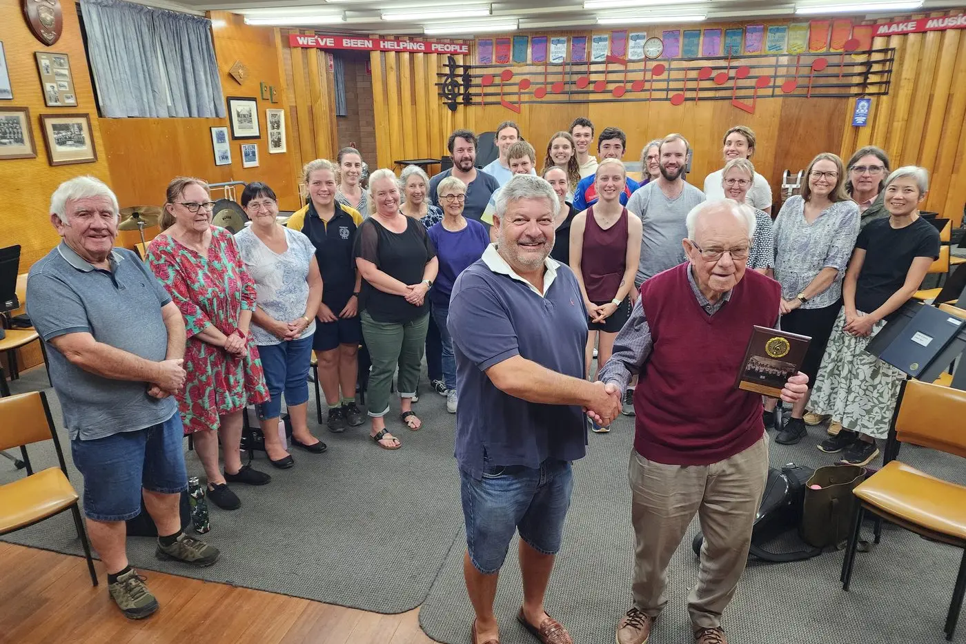 Tony Wheatland with a special plaque presented by members of Dubbo District Concert Band after his long service as president. Photo: Dubbo Photo News/Ken Smith.