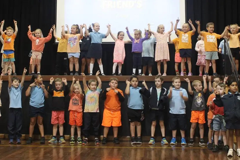 Kindergarten to Year 3 students performing in a combined choir and dance group for their grandfriends. Photo: Supplied.