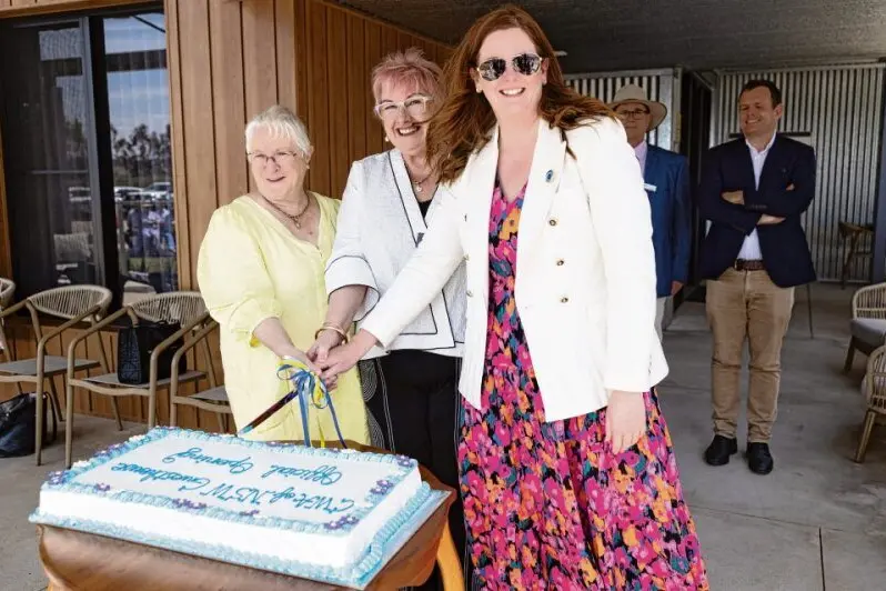 Immediate past president of CWA NSW, Joy Beames, current president Tanya Jolly, and CEO Danica Leys cut the cake at the opening of the CWA of NSW Guesthouse at Macquarie Home Stay. 
