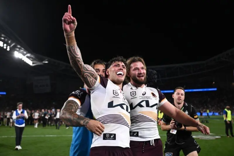 Kotoni Staggs (centre) may have ridden to grand final glory on the karma bus. Photo: AAP/Dan Himbrechts