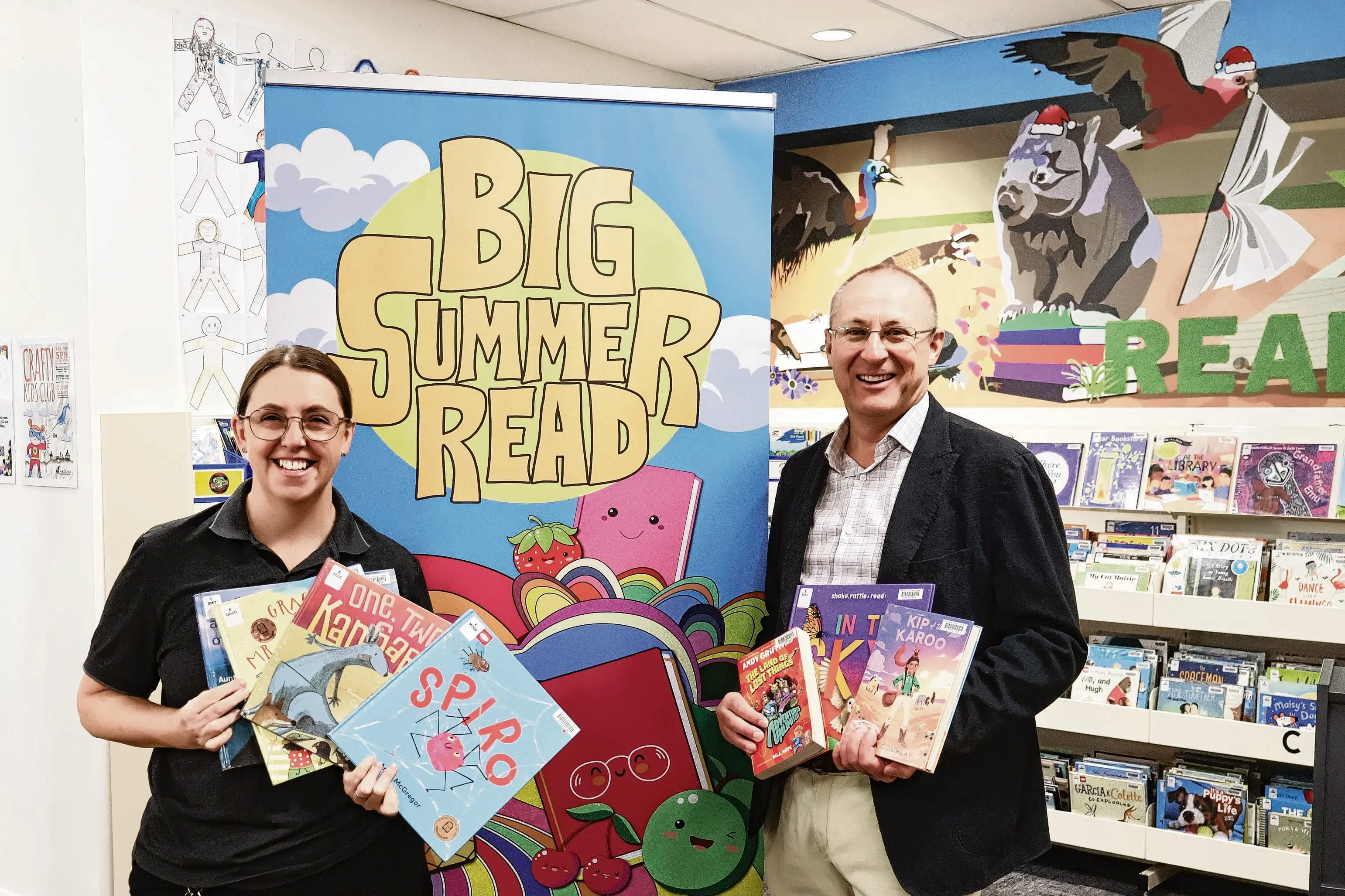 <p>Off the iPad and into a good book! Encouraging our young to maintain their reading these summer holidays via the Big Summer Read promotion, Macquarie Regional Library Children and Young People\\u2019s Services Officer, Suzie Samson, with literary buff mayor, Josh Black. Photo: Supplied</p>\\n