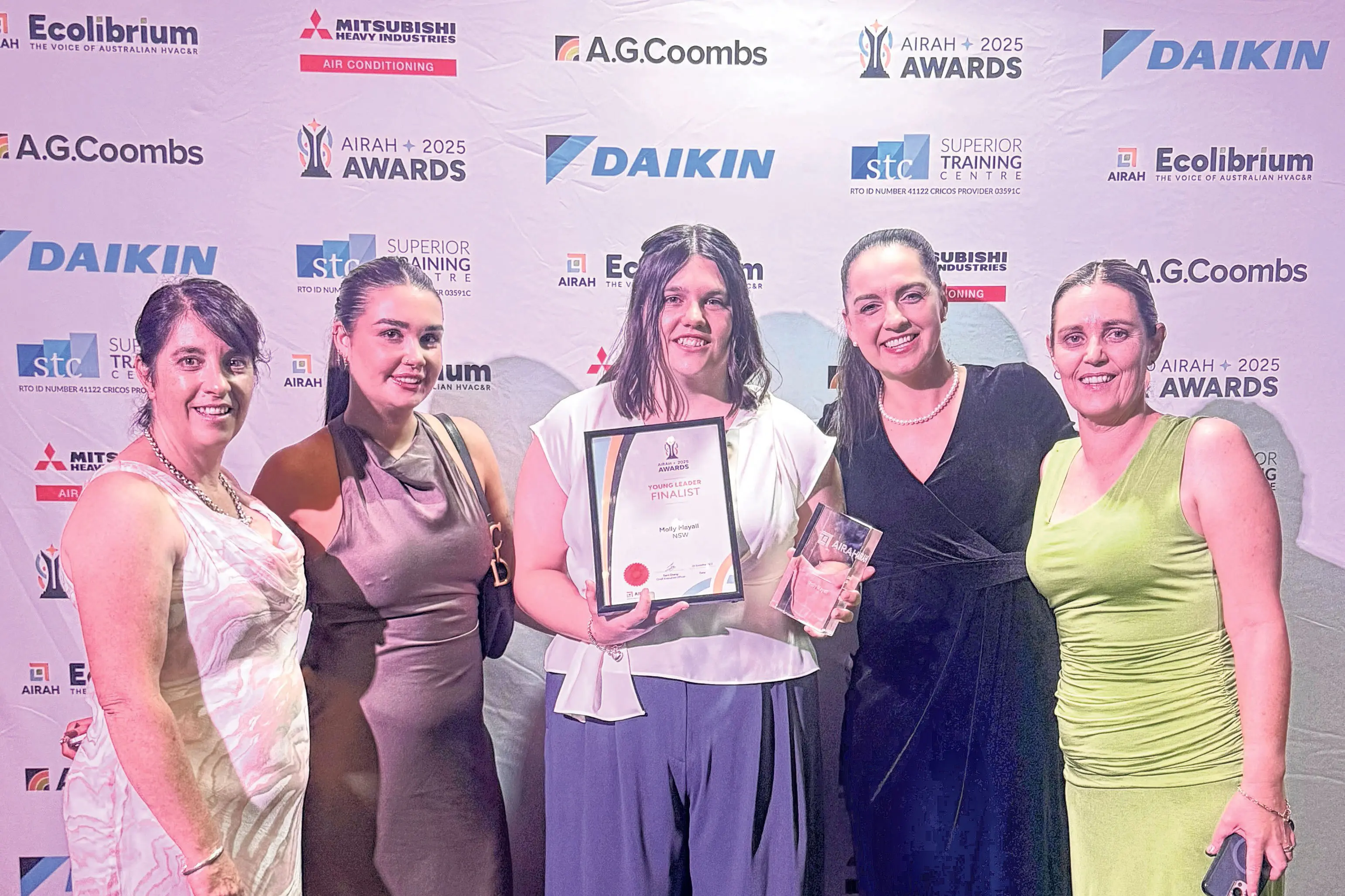 <p>First-year Electrical Apprentice Molly Mayall (centre) after winning the industry award as the AIRAH National Young Leader prize for 2025. Photo: Supplied</p>\\n