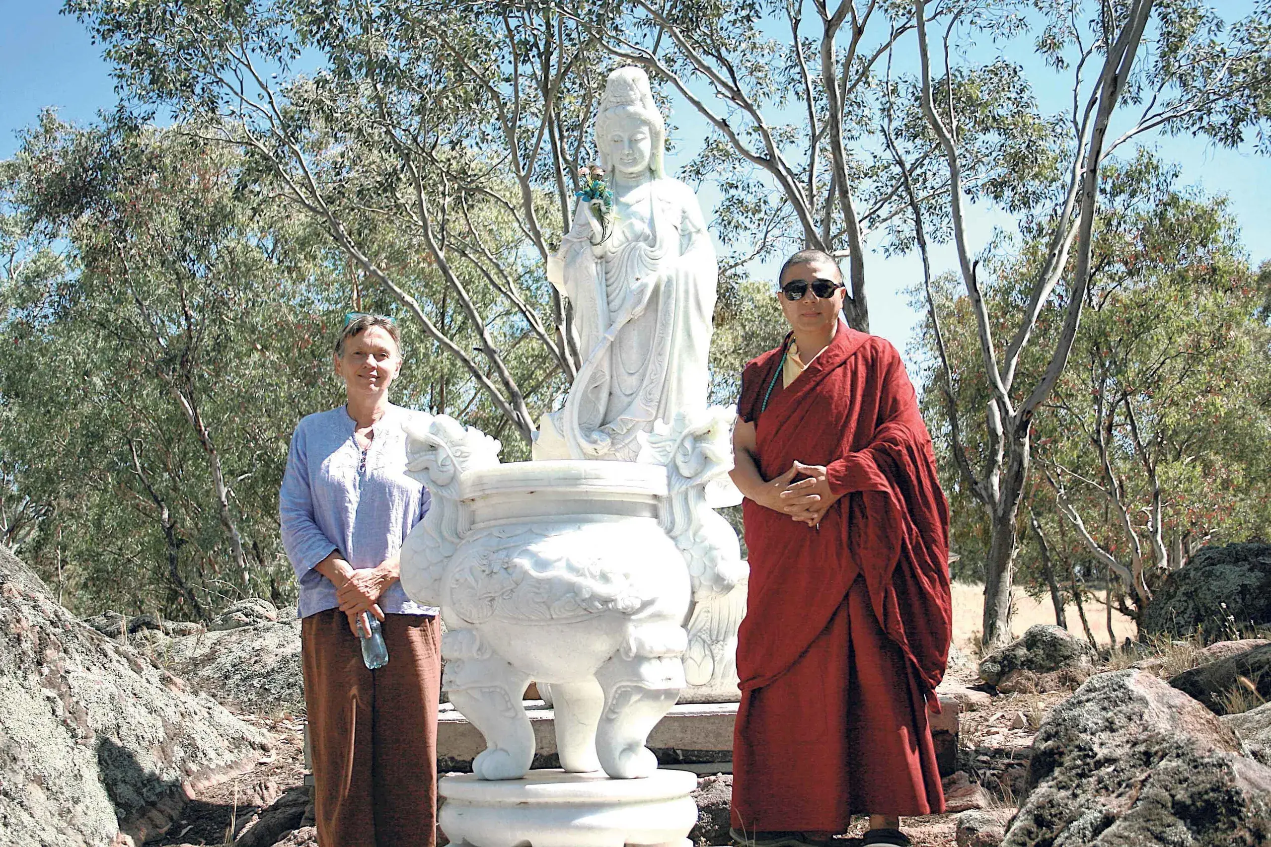 <p>Volunteer Rosie Aguila and revered monk Lama Chewang Norbu Bhutia with a representation of the female God, Bodhisattava, at the Karma Yiwang Samten Ling Buddhist temple and retreat. Photos: Dubbo Photo News</p>\\n