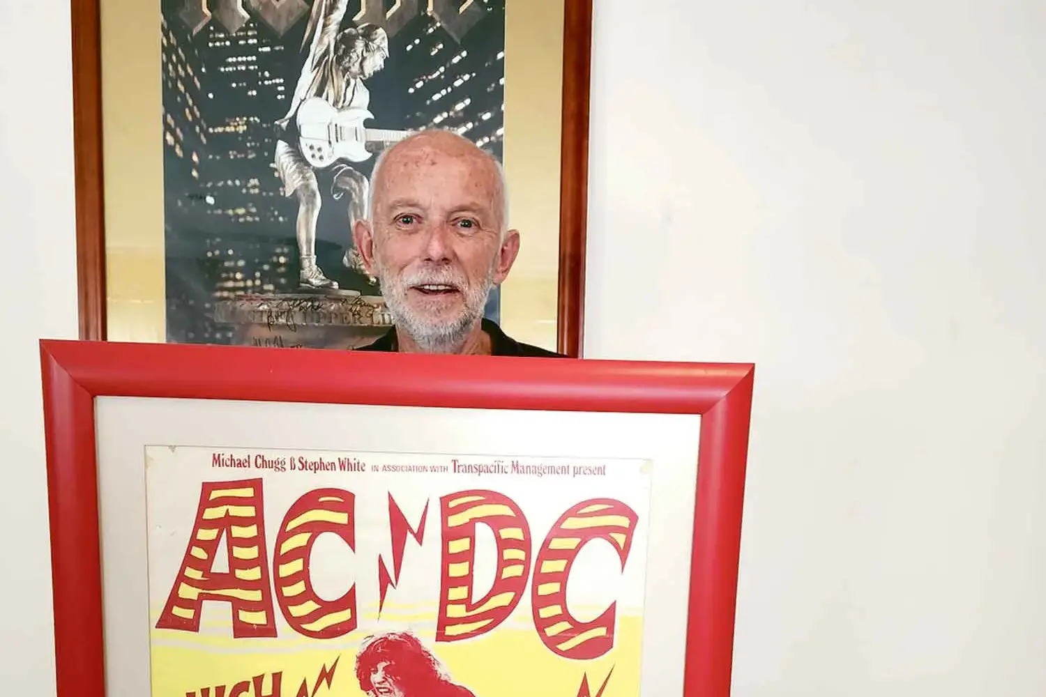<p>Ken Smith with his \"high voltage\" AC/DC poster. Photo: Dubbo Photo News</p>\\n