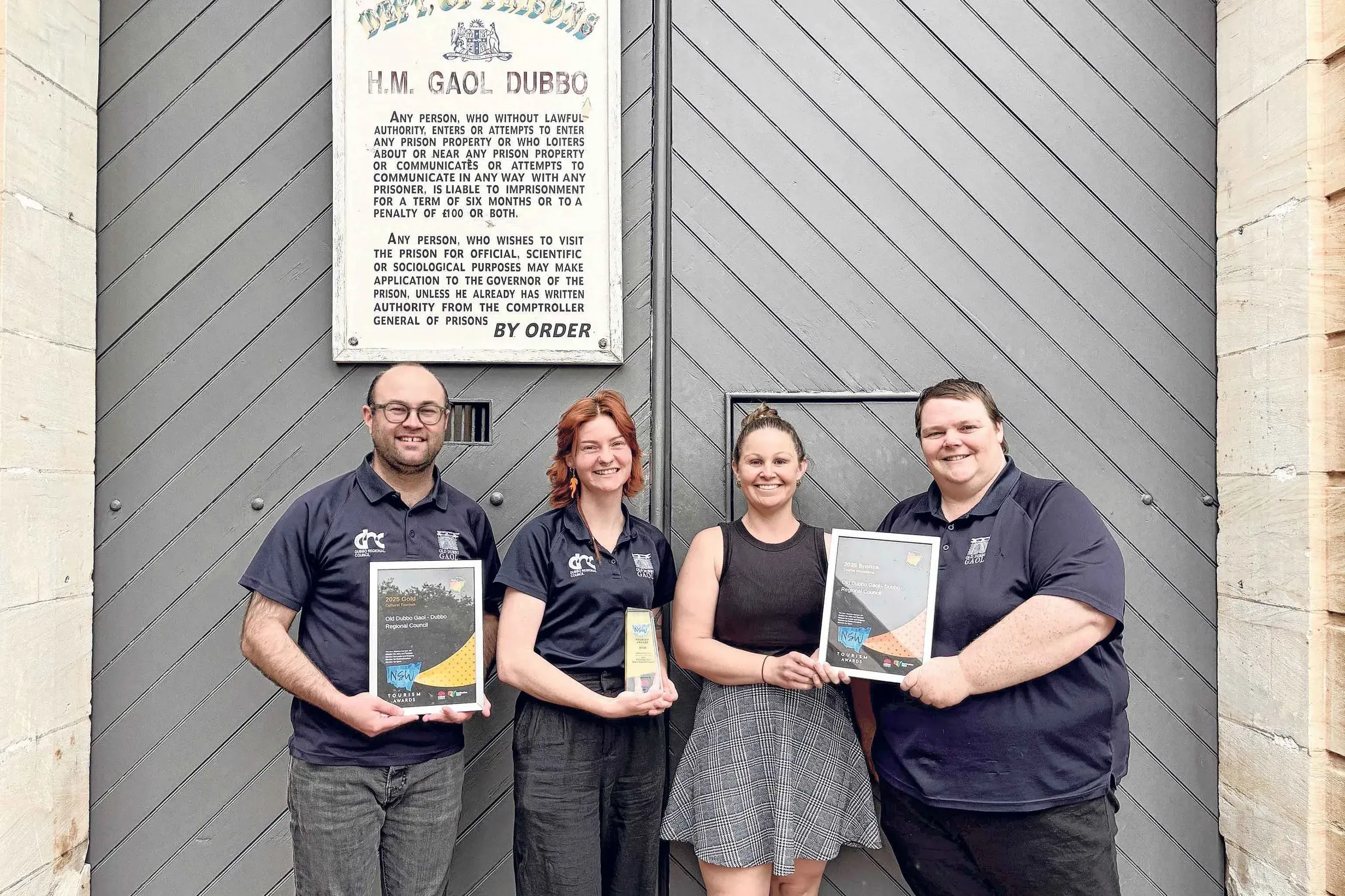 <p>Old Dubbo Gaol team members Chris Anemaat, Milla Ross, Jane Bendall, and Josh Ronan, with their recent NSW Tourism Awards. Photo: Supplied</p>\\n