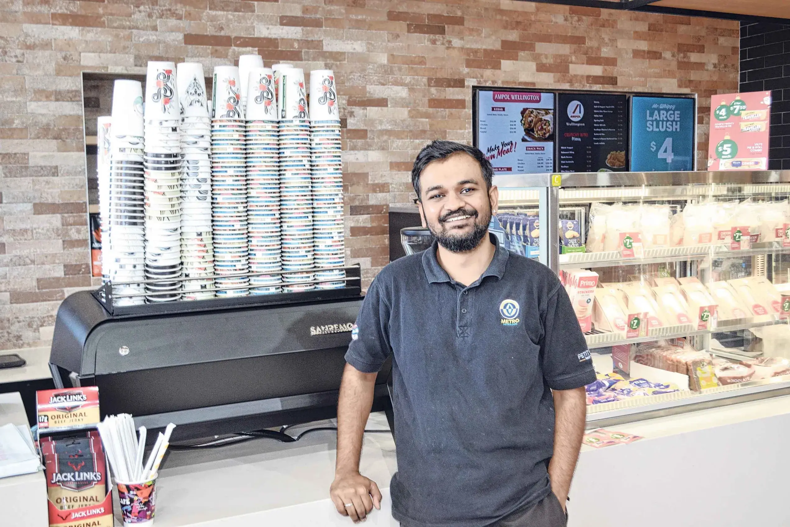 <p>Bhavik Shiroya is ready to welcome new patrons to Ampol Amplify, Wellington. Photos: Colin Rouse.</p>\\n