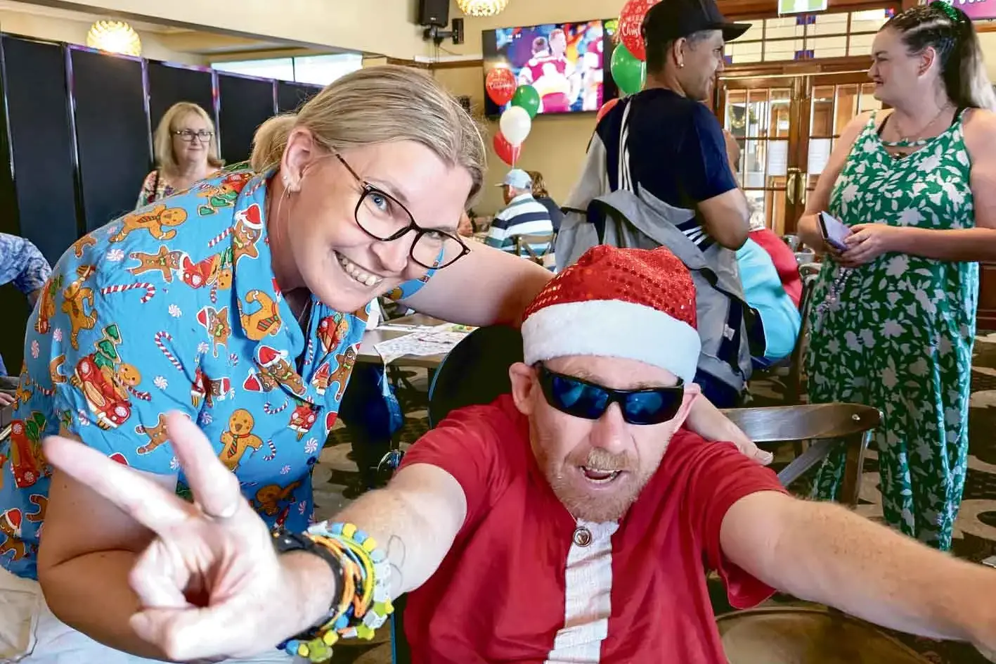 <p>Some of the fun enjoyed by clients and staff at the Challenge Community Services\\' Christmas party. Photo: Supplied</p>\\n