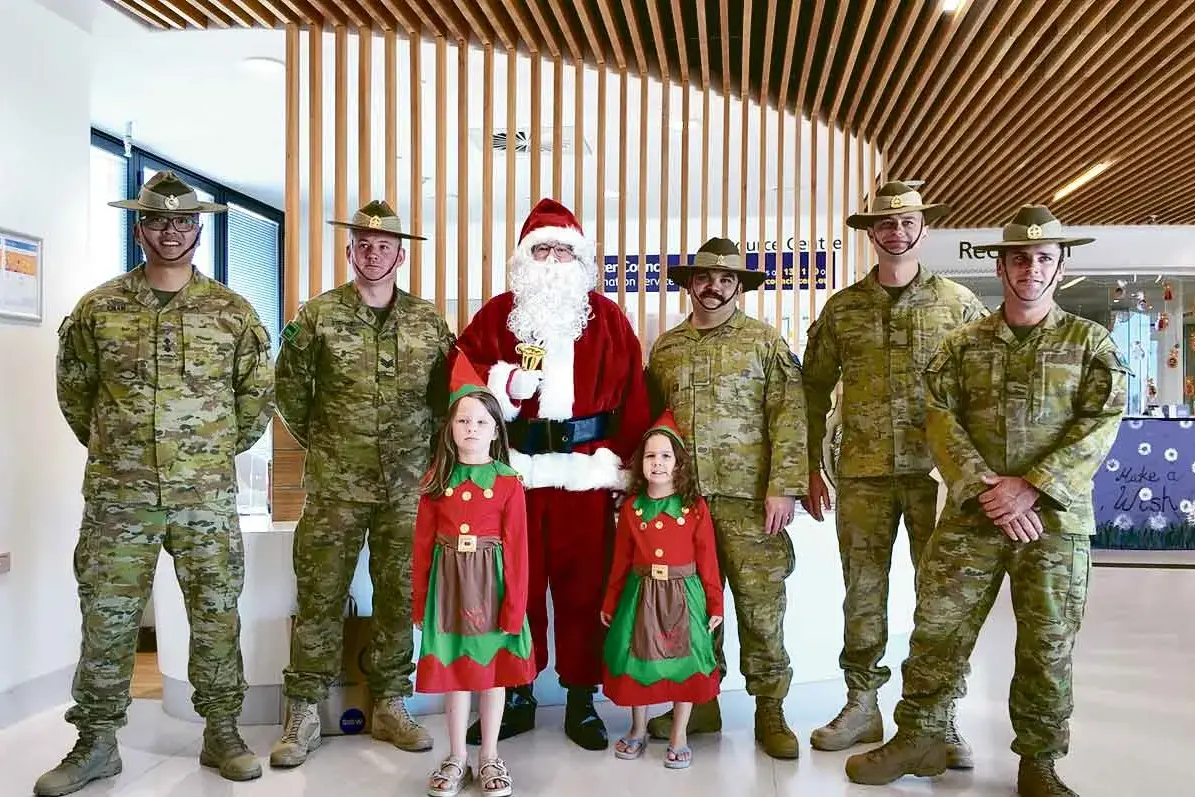 <p>True superheroes don\\'t wear capes... the Army Reserve team that spread so much Christmas spirit at Dubbo Base last week. Photo: Dubbo Photo News</p>\\n