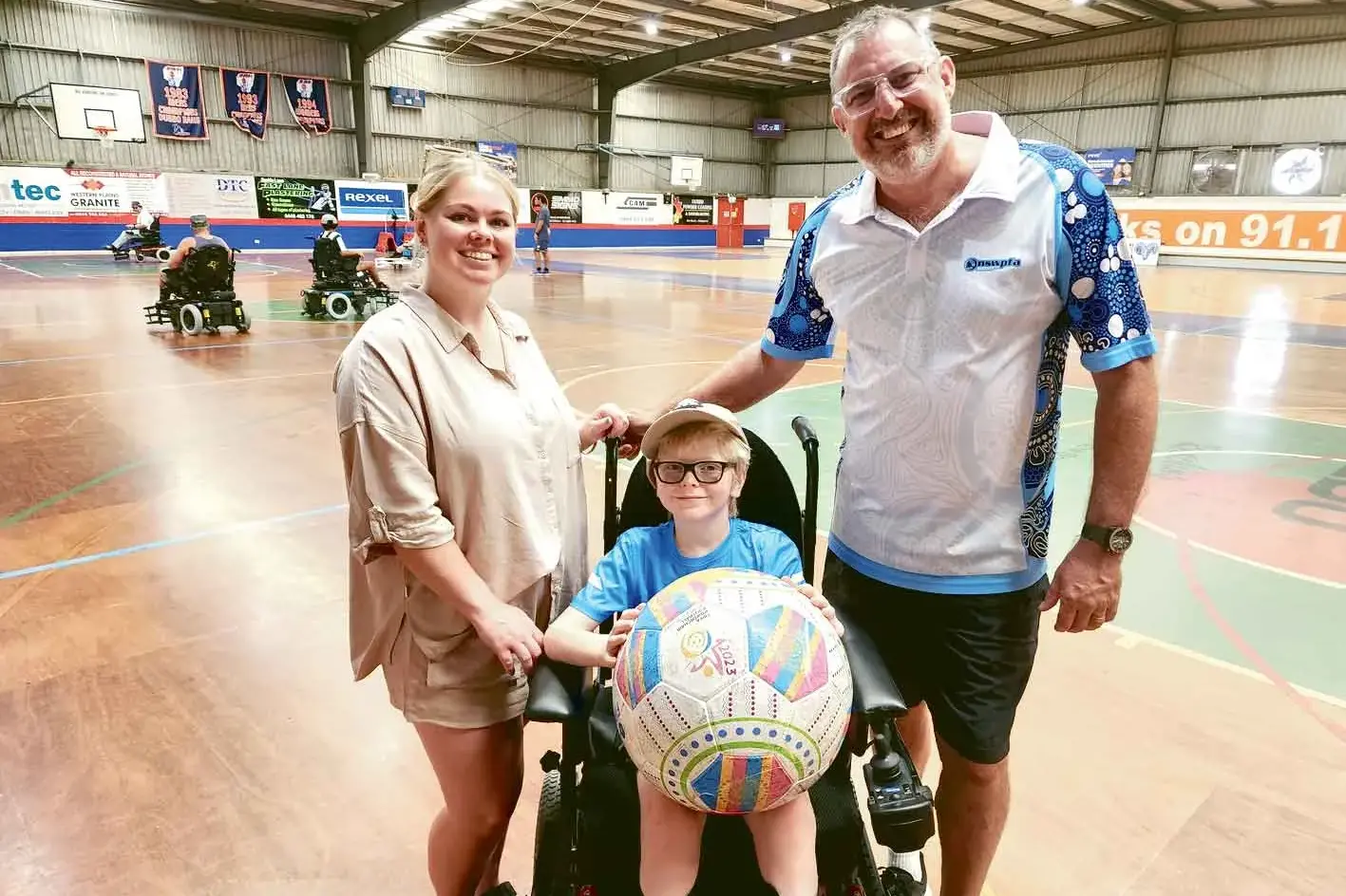 <p>Zoe Artery from Dubbo PCYC, Jay Artery, and Jason Ryan from the NSW Powerchair Football Association. Photo: Dubbo Photo News</p>\\n