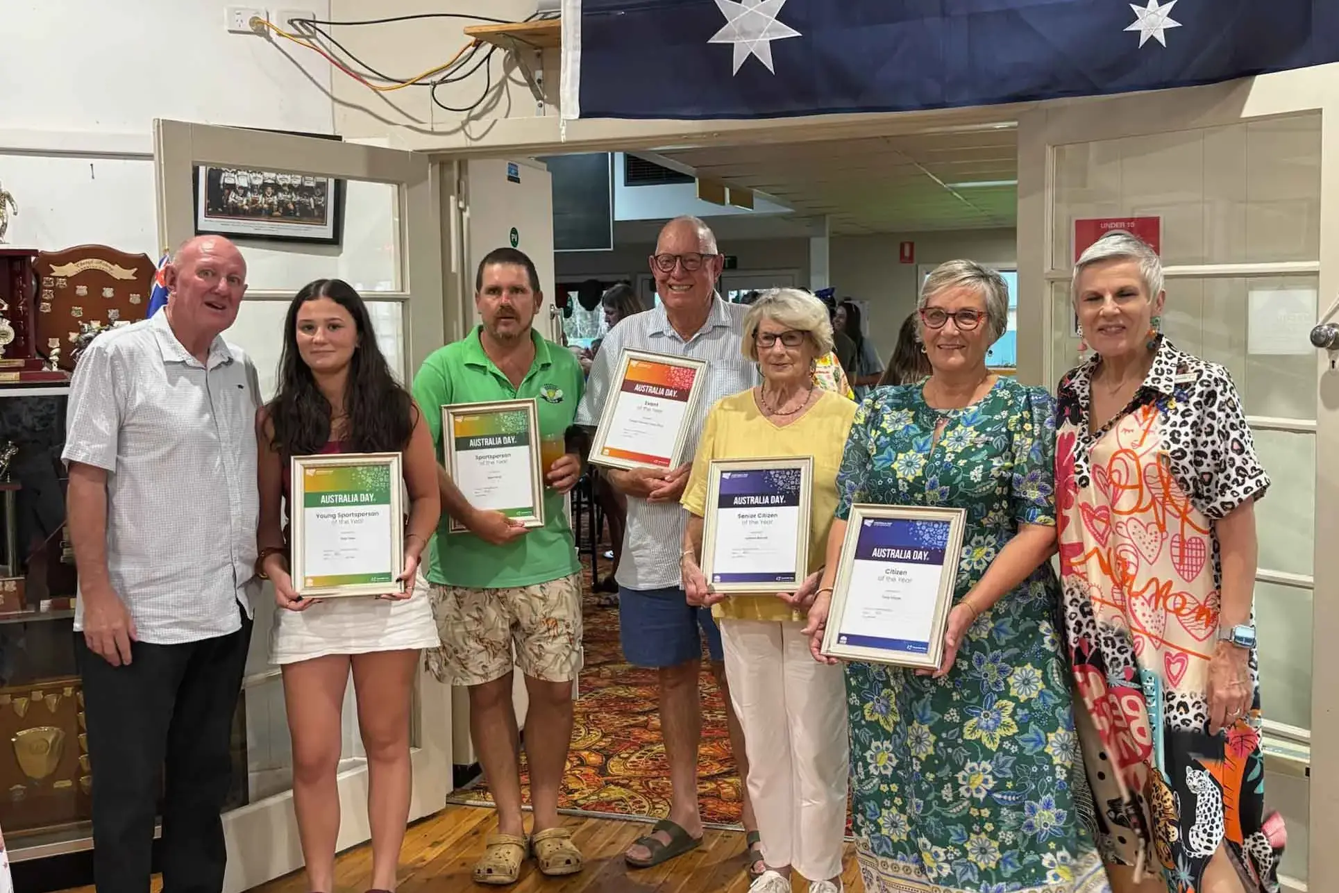 <p>Trangie\\u2019s Australia Day Ambassador, Geoff Mann; Sportsperson of the Year, Adam Bond; Young Sportsperson of the Year, Kate Hoey; Rob McCutcheon representing Trangie Truck and Tractor Show for Event of the Year; Senior Citizen of the Year, Kathleen Bennett; Citizen of the Year, Terrie Milgate; and Narromine\\u2019s Australia Day Ambassador, Susie Elelman AM. Absent: Young Citizen of the Year, Tawhiao Selway. Photo: Narromine Shire Council.</p>\\n