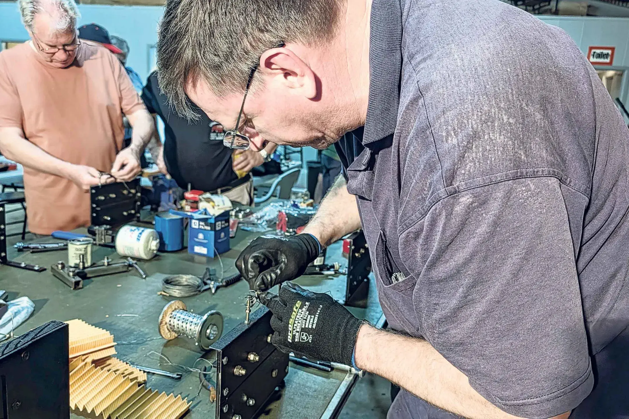 <p>Participants at the SAAA aviation training conducting a lock wiring check. Photo: Elaine Bradley</p>\\n