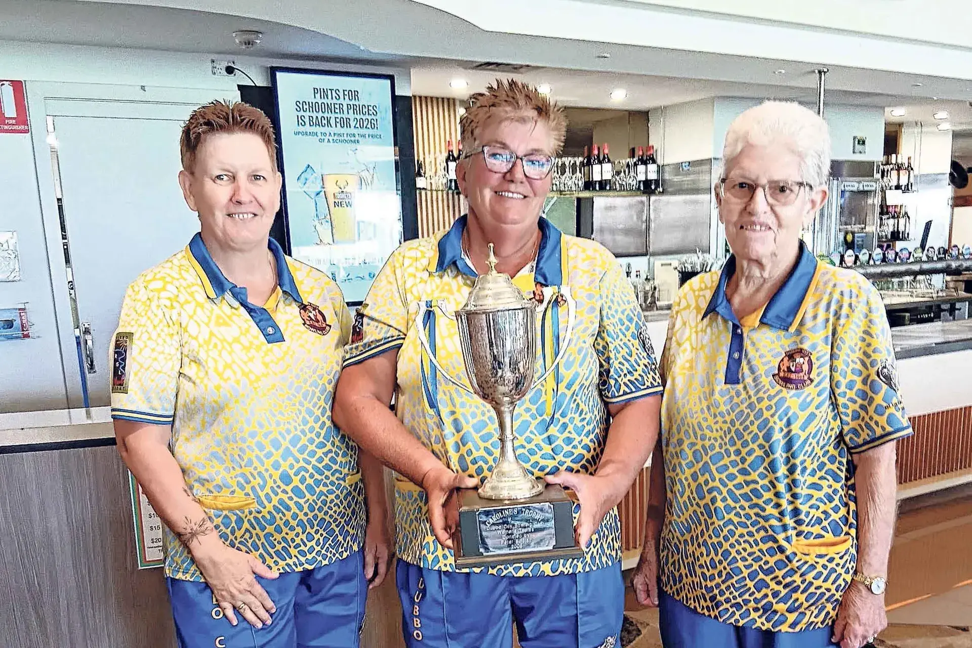 <p>Winners are grinners: Gai Teale, Sharon Johnston and Annette McMillan with the Caroline Trophy. Photos: Back Bowls</p>\\n