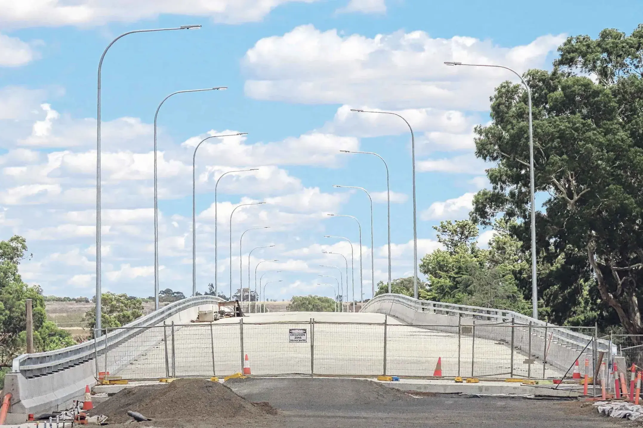 <p>Up and over: New street lighting on the nearly-completed River Street crossing of the Macquarie River. Photo: Dubbo Photo News. </p>\\n