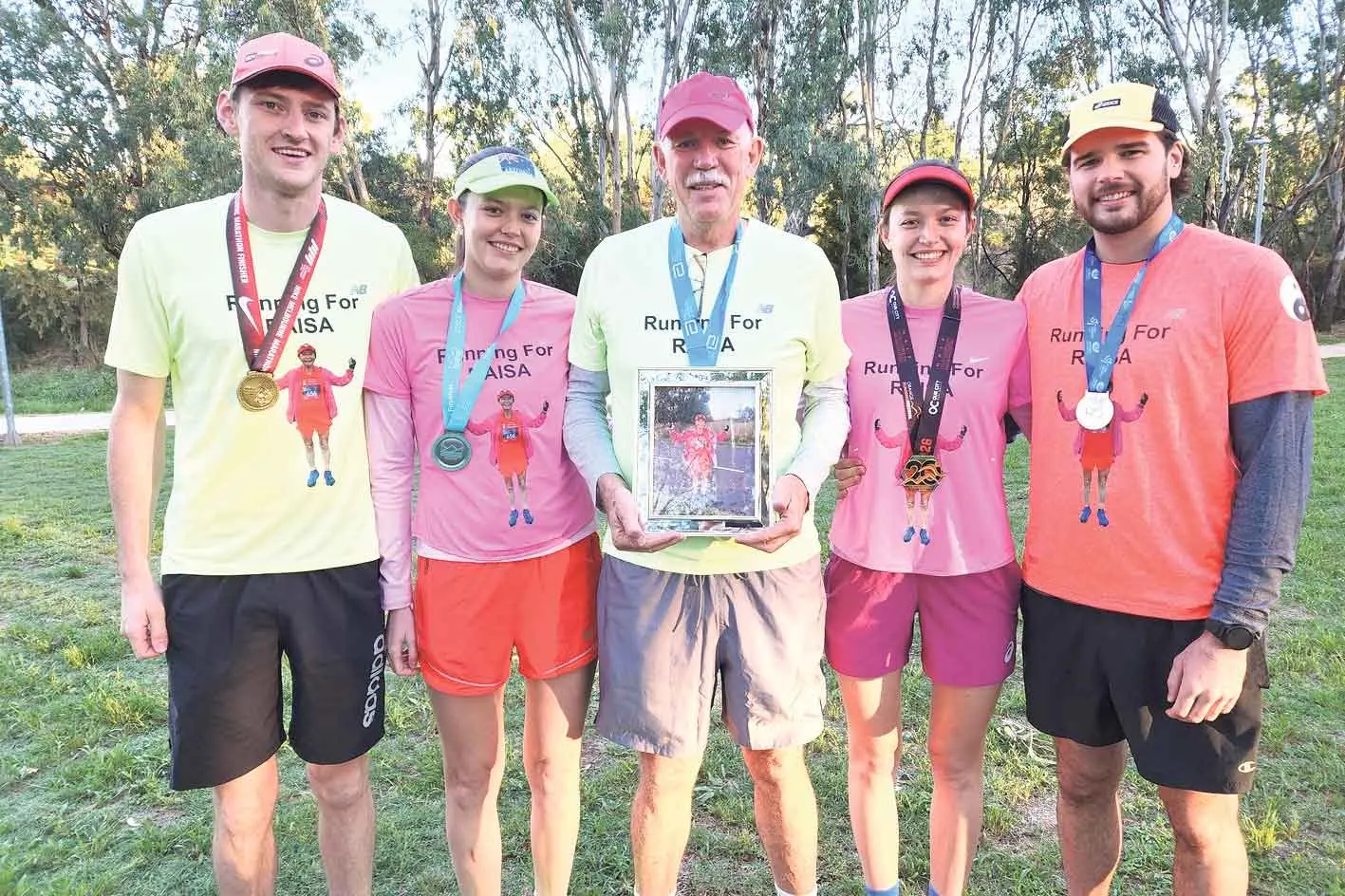 <p>Tim Wall, Lara Carter, Adam Carter, Tamara Carter and Mikey Carroll joined the colourful parkrun tribute to their loved one Raisa Kolesnikova on March 28. Photo: Dubbo Photo News/Ken Smith</p>\\n