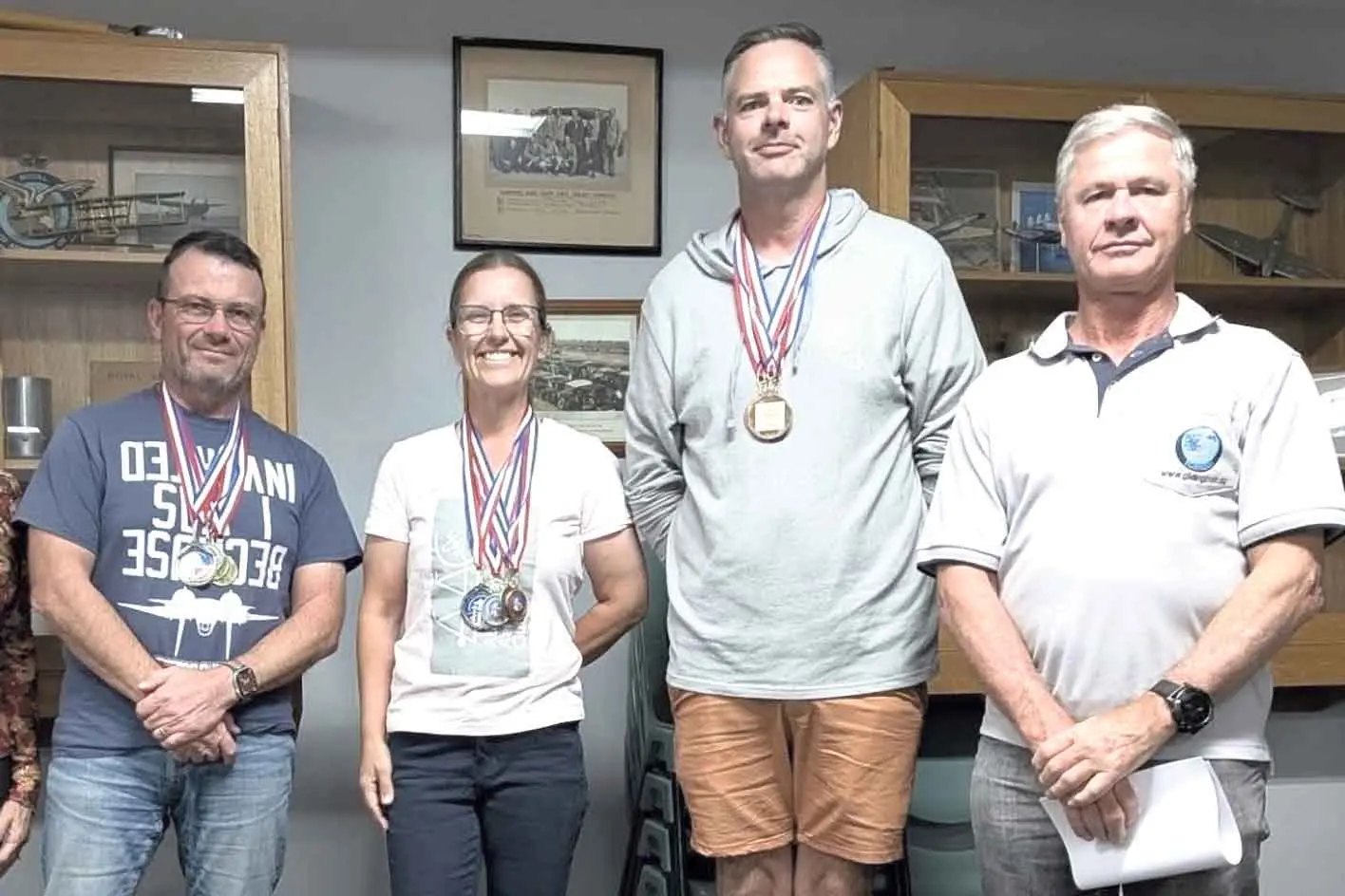 <p>A very happy Grace (second left) placed second overall in her category at the recent NSW Aerobatic Championships. Pictured with Brian Grinter (gold), Dale Robertson (bronze) and Richard Willis (chief judge). Photo: Supplied</p>\\n