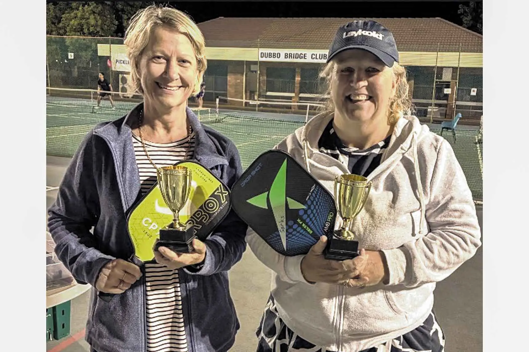 <p>Sue and Virginia holding the \\u201CGold\\u201D series Dubbo PIckleball trophies. Photo: Supplied</p>\\n