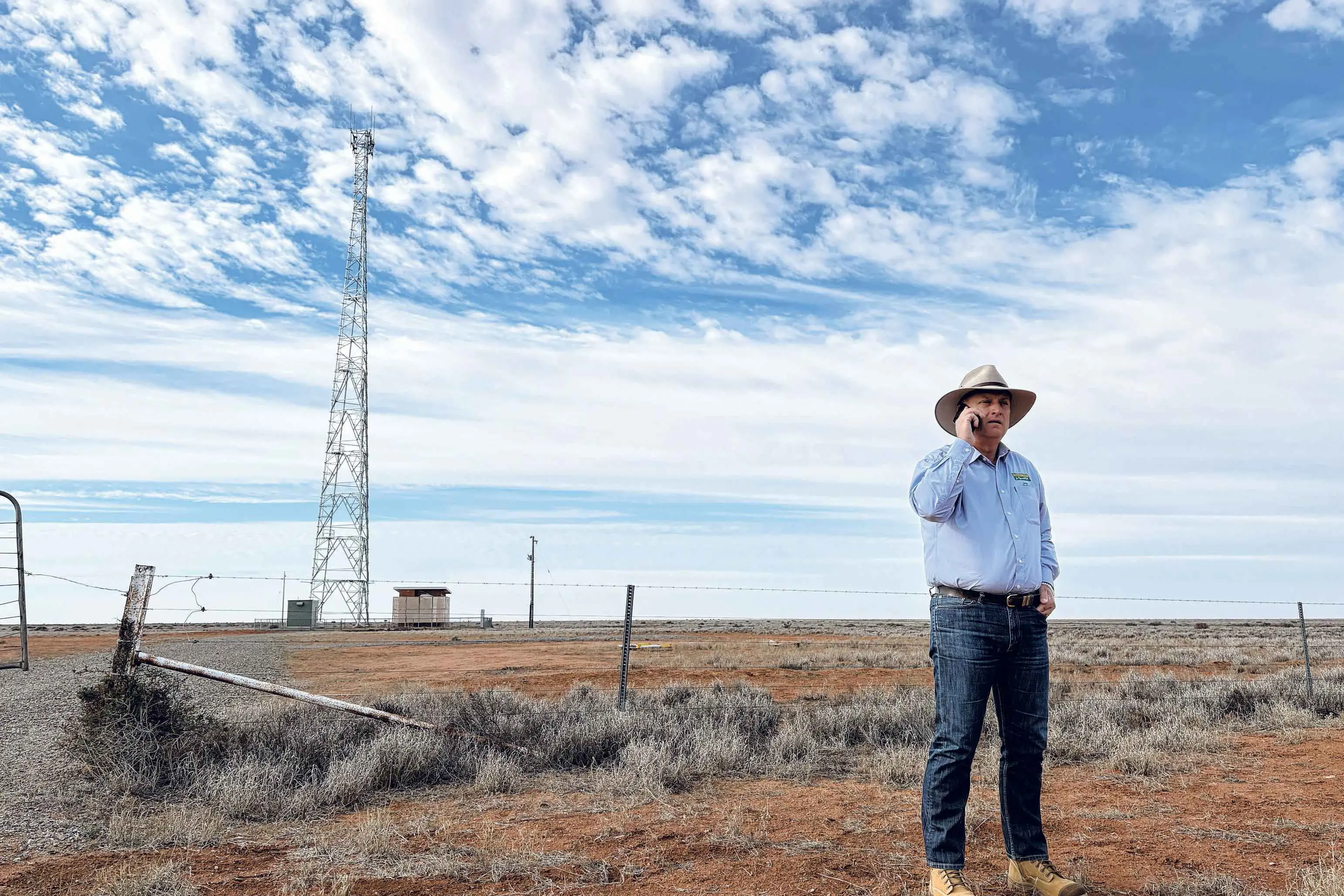 <p>Limited range... Federal Member for Parkes Jamie Chaffey makes a phone call between Broken Hill and Wilcannia alongside a telecommunications tower. Photo: Supplied</p>\\n
