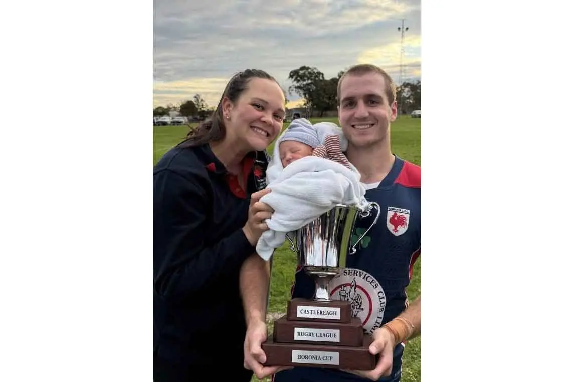 <p>Cobar Roosters and 2026 Western Rams player Tom Plater with partner Tia and their newborn Lawson with the Boronia Cup. Photo: Supplied. </p>\\n