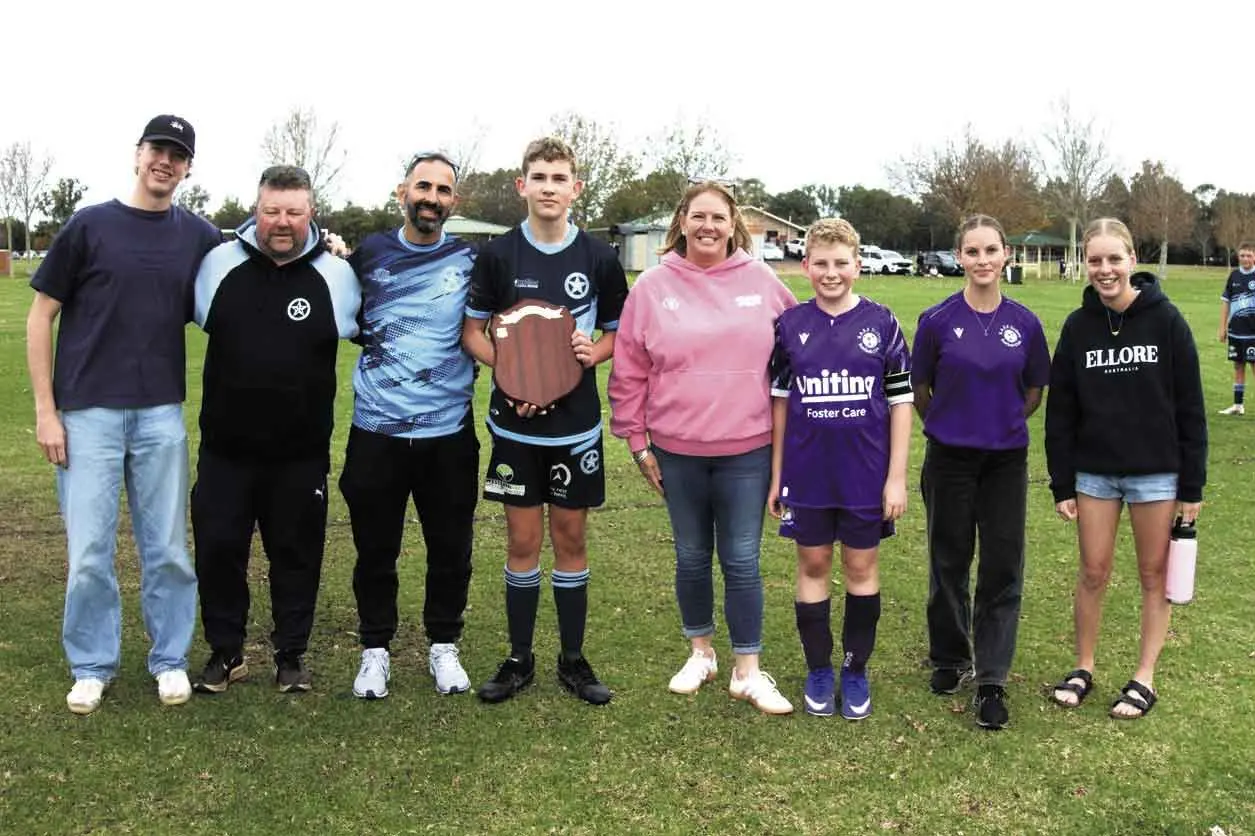 <p>The Hawkins family with team representatives. Photo: Supplied. </p>\\n