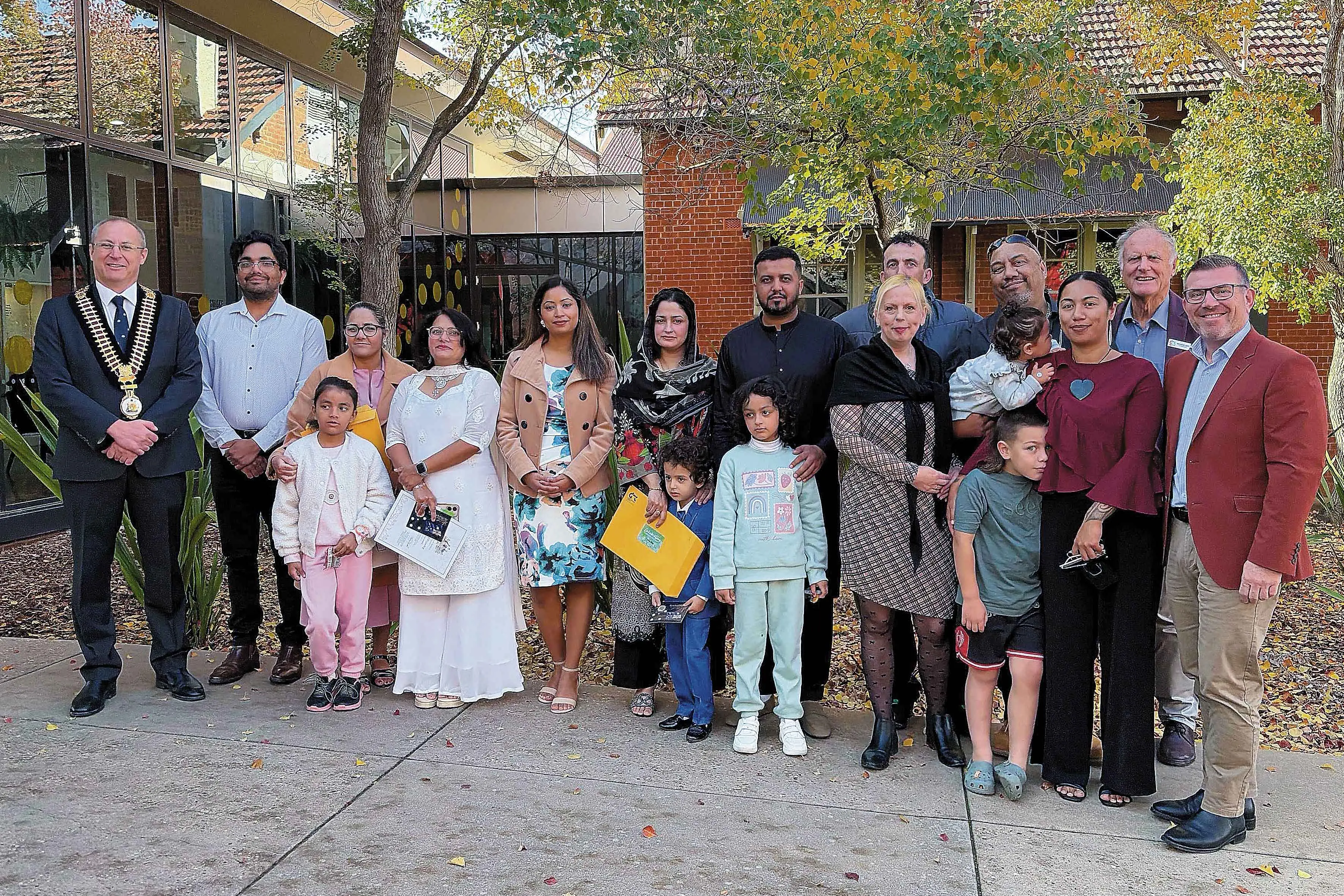 <p>Dubbo Mayor, Cr Josh Black (left) and Dubbo MP Dugald Saunders (right) with some of the new citizens on June 16. Photo: Supplied. </p>\\n