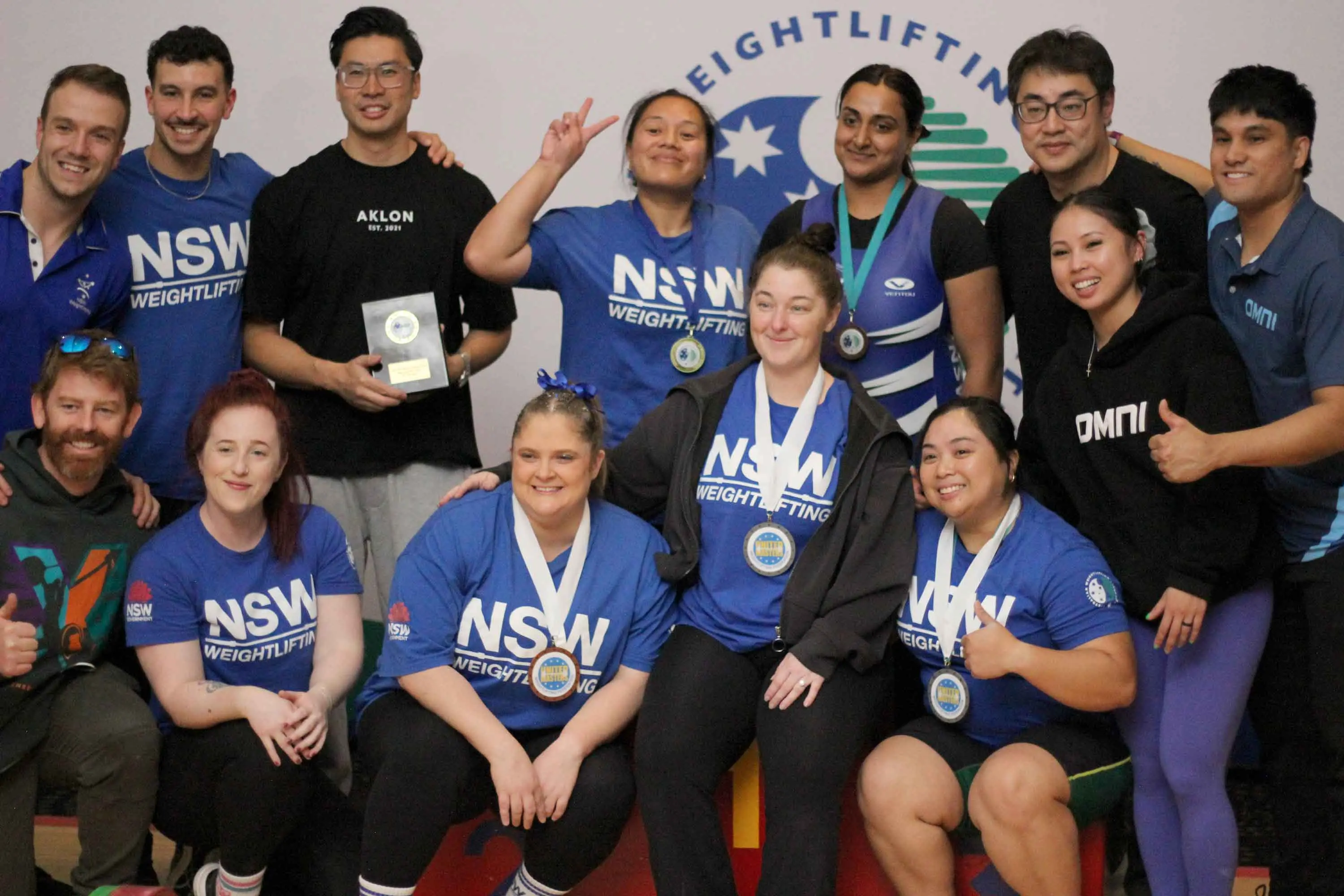 <p>Local weightlifter, Kimberly Walter, (kneeling, third from left) has returned home from a successful week of competition. Photo: Supplied</p>\\n