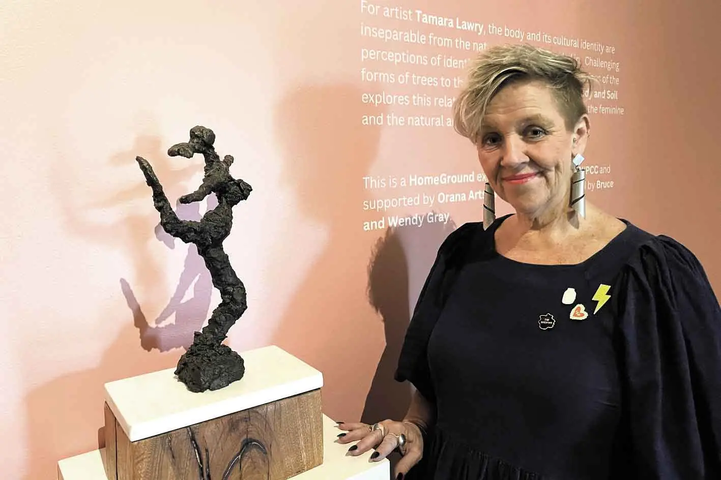 <p>HomeGround artist Tamara Lawry with one of her artworks in her first solo exhibition on now at the at the Western Plains Cultural Centre. Photo: Supplied</p>\\n