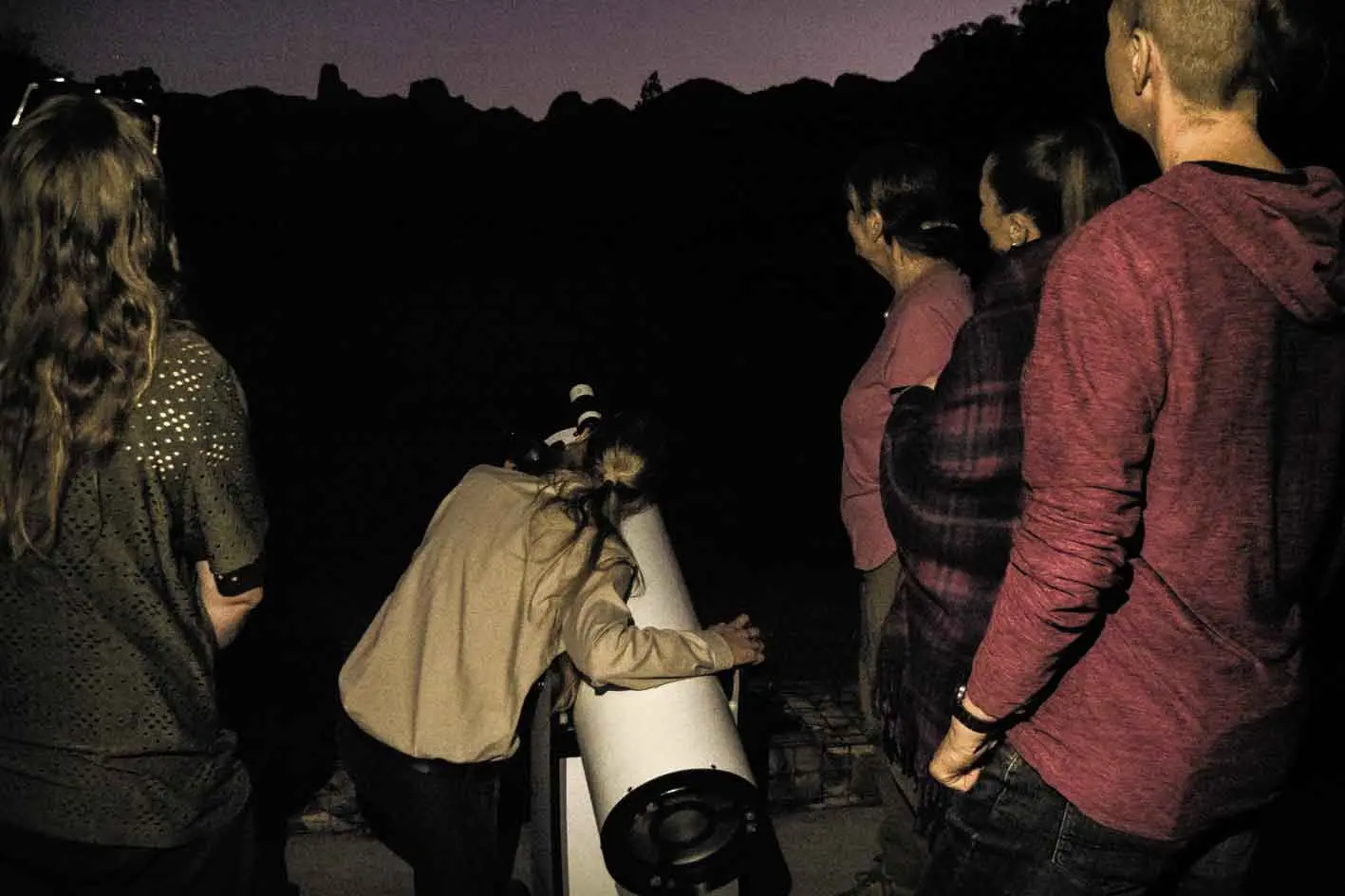 <p>Visitors enjoying the Dark Sky Tour at Warrumbungle National Park. Photo: NPWS</p>\\n
