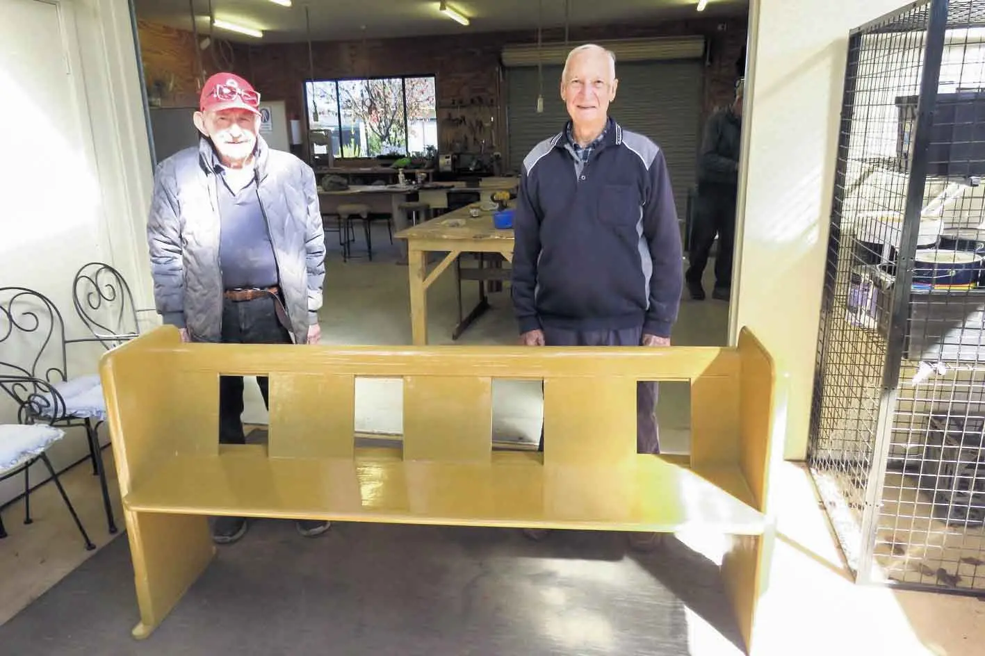 <p>Col Ferguson and John Weldon with the restored church pew. Photo: Alan Nelson</p>\\n
