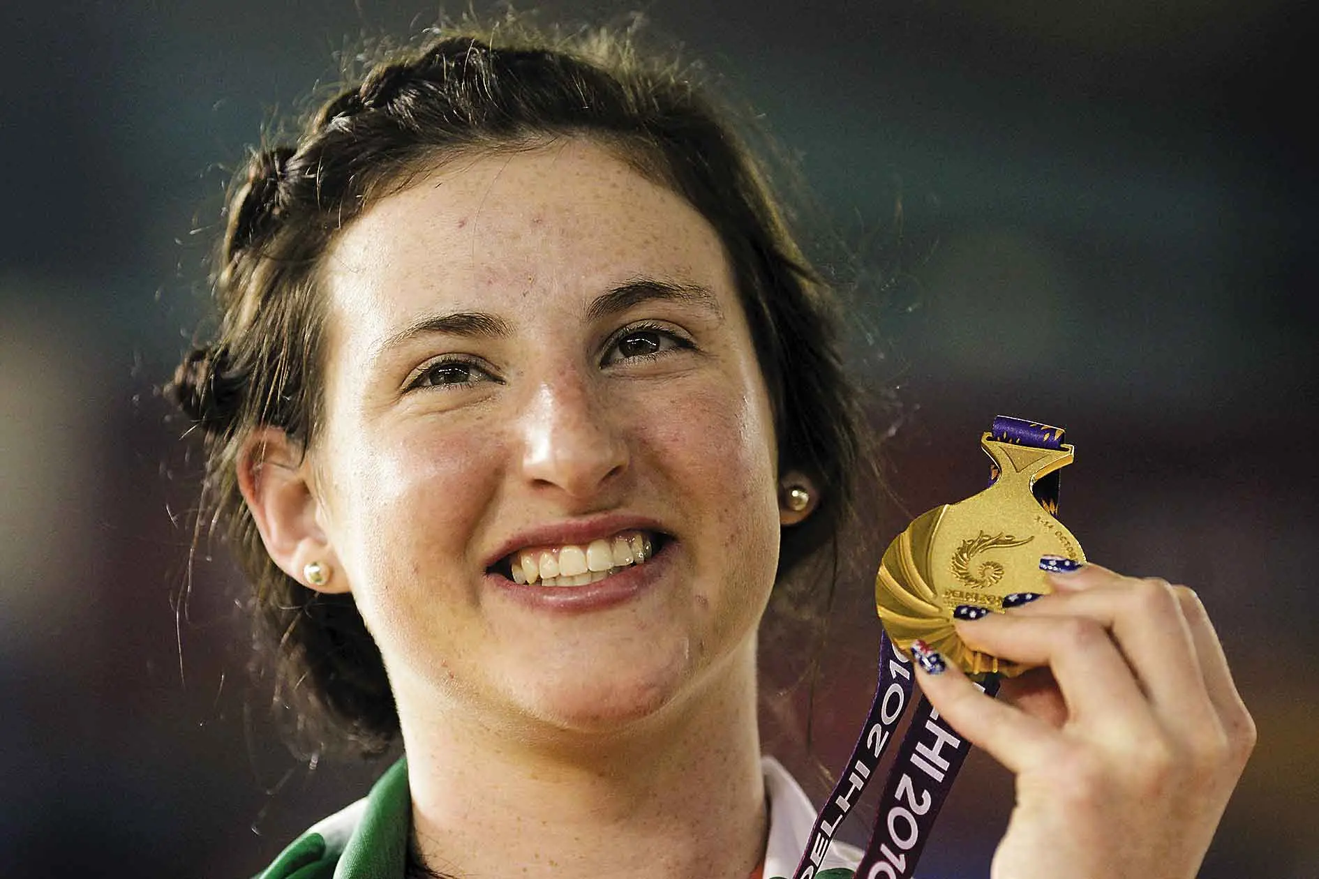 <p>Dubbo cyclist Megan Dunn beams with the gold medal she won in the women\\u2019s 10km scratch final during the Commonwealth Games in New Delhi, India, on October 7, 2010. Photo: AAP/AP Photo/Saurabh Dassa</p>\\n