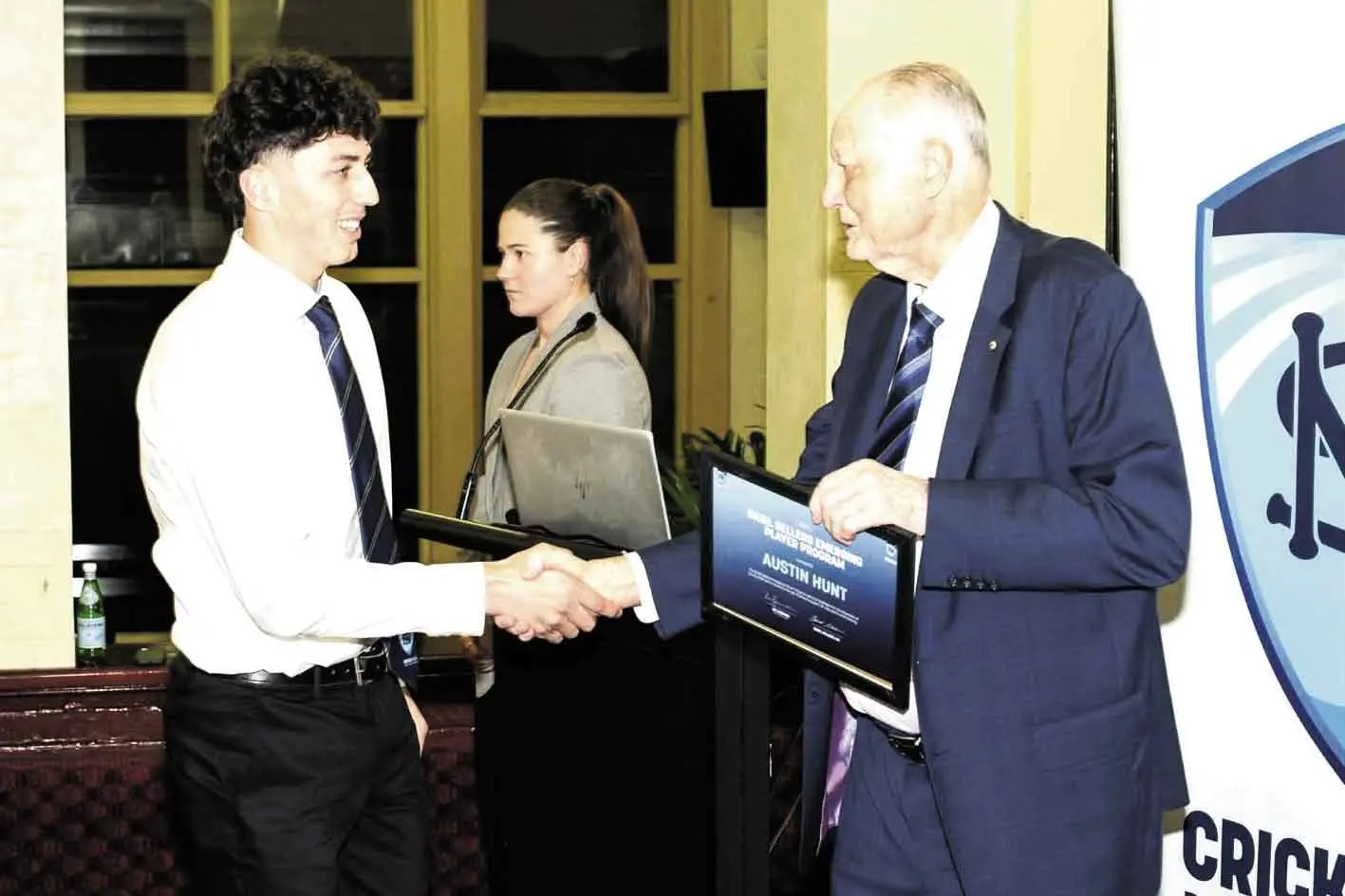 <p>Local cricket fast bowling prospect, Austin Hunt, receiving his official intake notification to the Basil Sellers Emerging Player Program from Basil Sellers AO. Photo: Cricket NSW</p>\\n