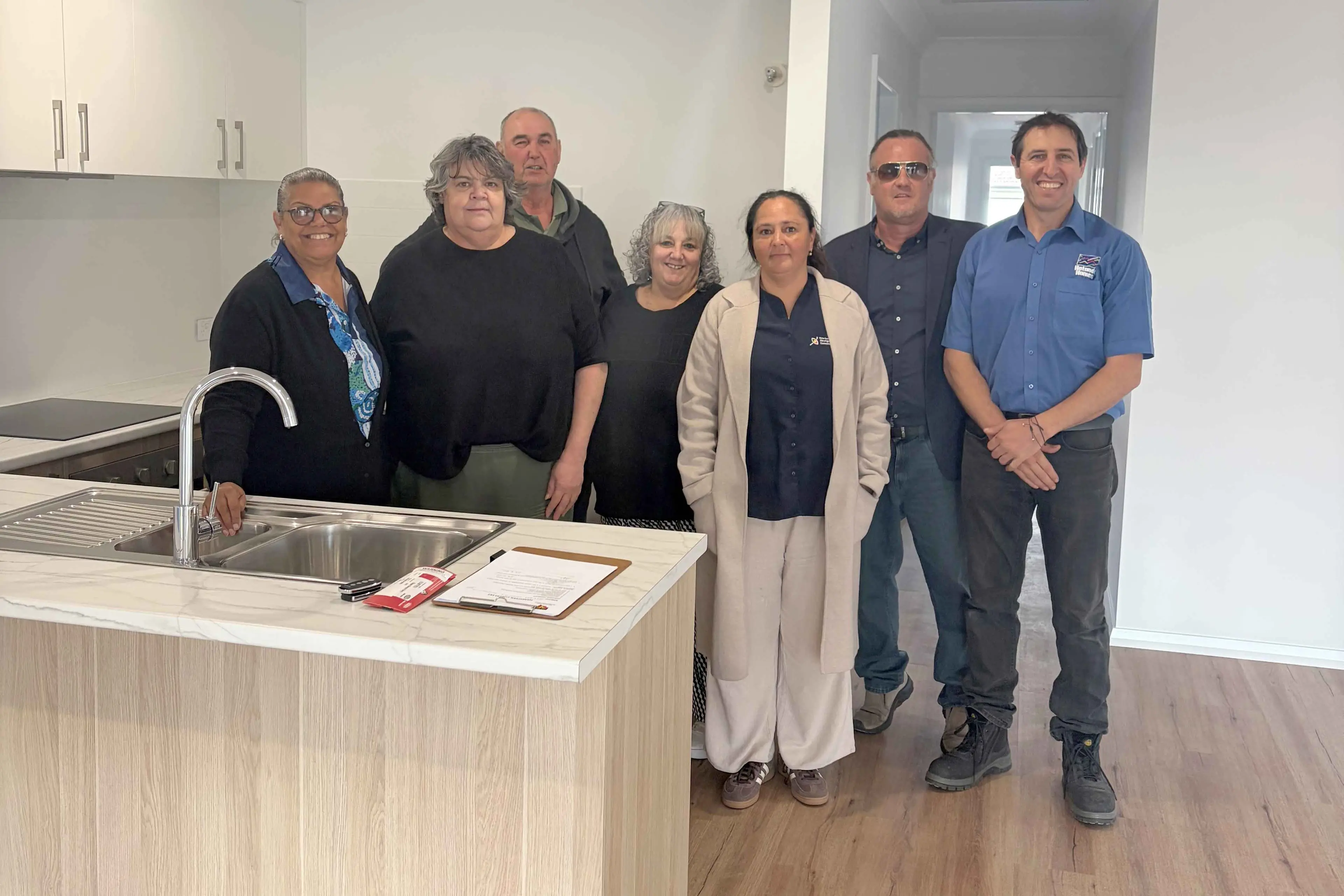<p>Narromine LALC members inside the newly completed property. Photo: NSWALC</p>\\n