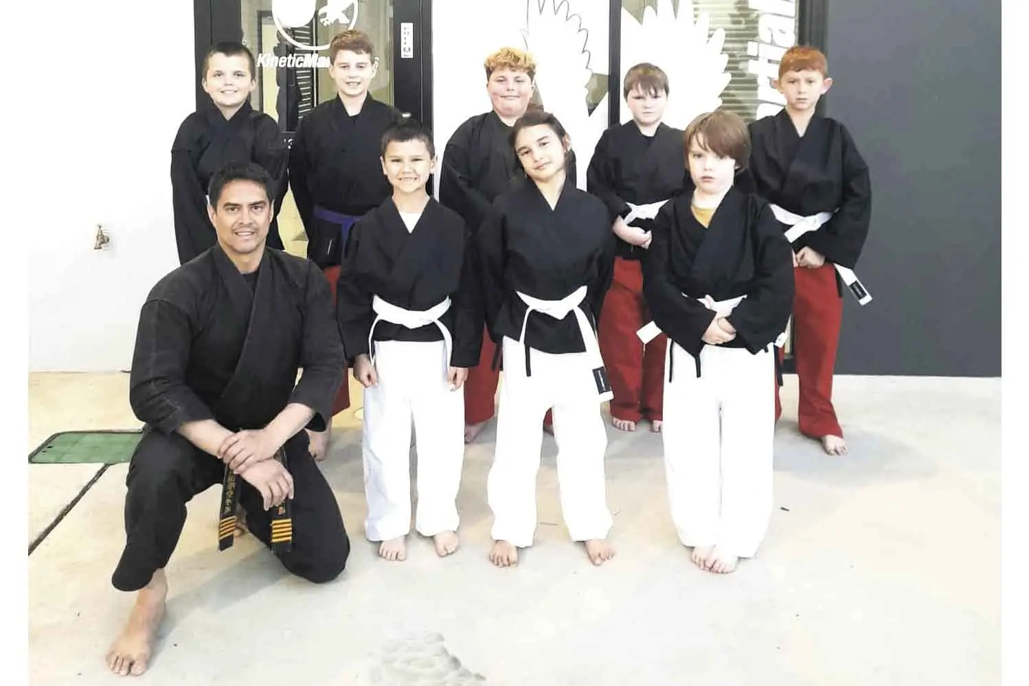 <p>George Sayers, bottom left, with students. Photo: Supplied</p>\\n