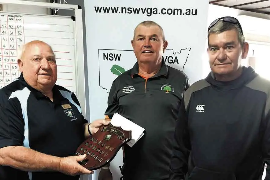 <p>2025 championships winners Rob Williams and Tony Mann receive their prize from John Dixon. Photo: Supplied</p>\\n